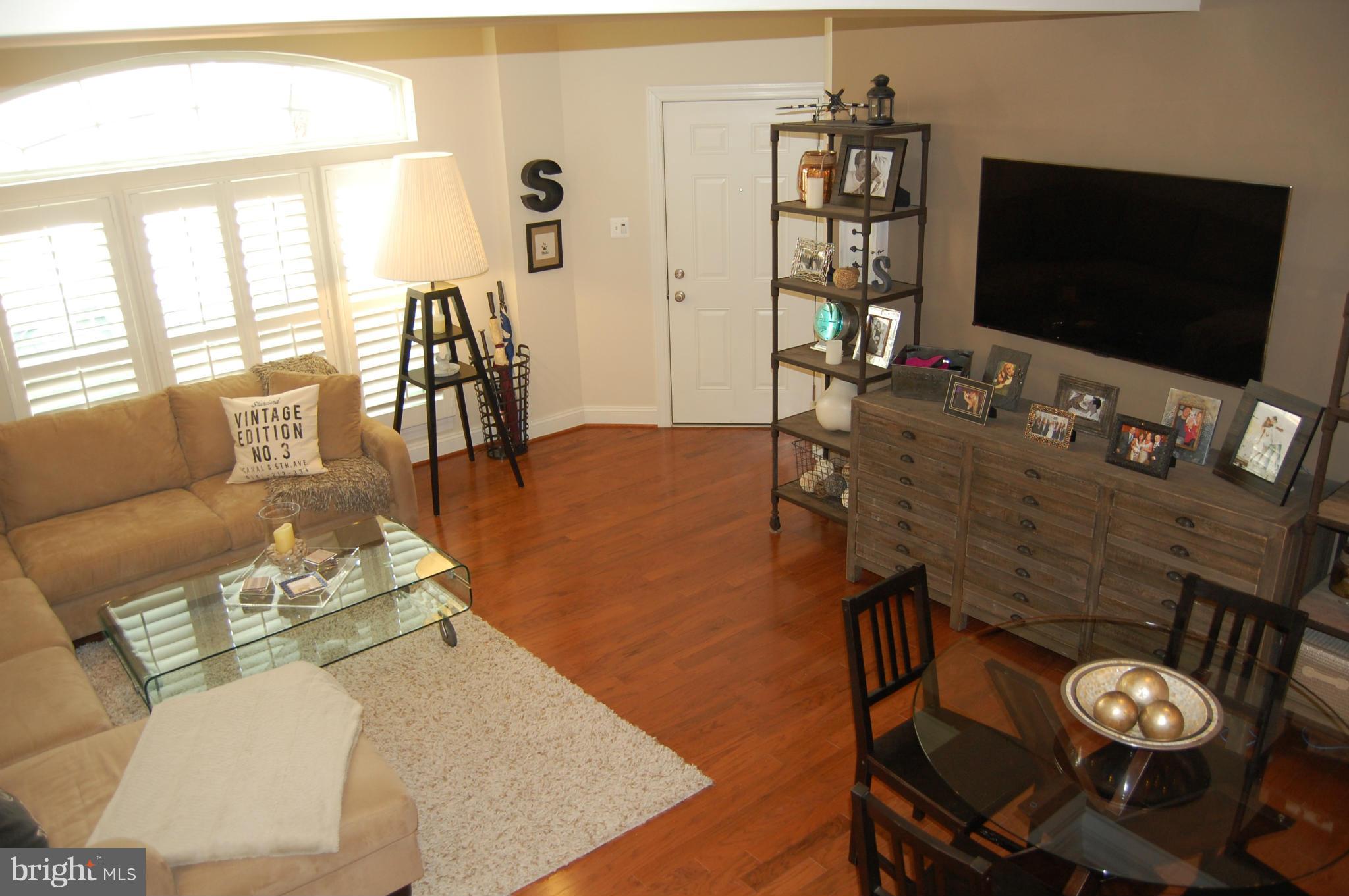 Masterfully decorated!Join the Parklands at the ground breaking stages before the proposed future town center gets under way.Existing community amenities include large swimming pool/fitness center/tot lot/tennis courts.This lower unit includes a 1 car garage (w/heater) and updated half bath, master br with 2 walk in closets,lighted tray ceiling.Check out the video on youtube by searching address.