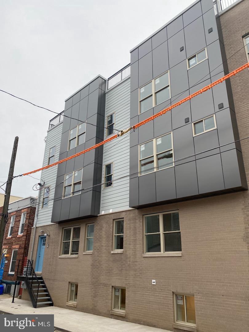 New Construction in desirable northern Fishtown section of the city. This large 3950 sq ft Triplex Boasts 3 units, 1 (3) bedroom (3) bath and 2 (2) bedroom (1) bath units.
Unit A is a Bi-level unit and has 3 bedrooms and 3 private baths. This Unit has private entrance to the main level. This level has a large office/den area and 2 large bedrooms . Each bedroom has its own custom ceramic tile full bath. The lower level has large open island kitchen and living room areas. The custom kitchen has Quartz countertops, Ceramic tile backsplash and stainless steel appliances including built in microwave, dishwasher, range and refrigerator. The large main bedroom is off the living room and has its own private custom tile full bath. The unit also has a large storage /laundry room and roof deck access. The size and layout of this unit is larger than most rowhomes in the neighborhood.
Unit B and C are large 925 sq ft units with 2 bedrooms and a large Jack and Jill designed semi private bath. This floorplan has large open island kitchen and living room areas. The custom kitchen has Quartz countertops, Ceramic tile backsplash and stainless steel appliances including built in microwave, dishwasher, range and refrigerator. The two large bedrooms each have their own private entrance to the custom tile bath. The units also have central air, camera door security and plenty of storage. There is also a large washer and dryer in the units and a designated roof deck area for all units. Great location near all the restaurants, cafe's and shopping Fishtown has to offer.
This is a turn key investment or live in one unit and rent out the other 2.