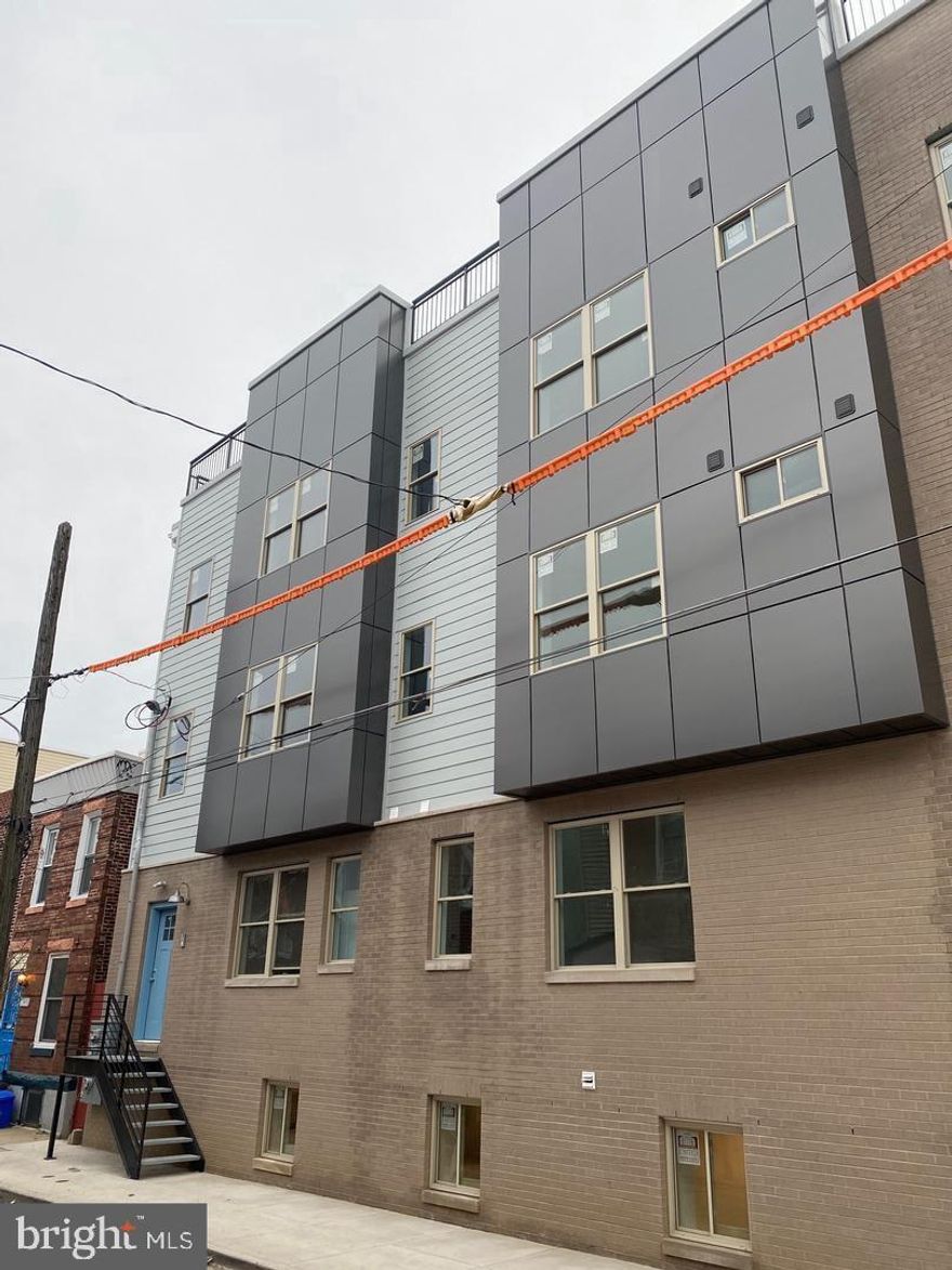 New Construction in desirable northern Fishtown section of the city. This large 3950 sq ft Triplex  Boasts 3 units, 1 (3) bedroom (3) bath and 2 (2) bedroom (1) bath units.
Unit A is a Bi-level unit and has 3 bedrooms and 3 private baths. This Unit has private entrance to the main level. This level has a large office/den area and 2 large bedrooms . Each bedroom has its own custom ceramic tile full bath. The lower level has large open island kitchen and living room areas. The custom kitchen has Quartz countertops, Ceramic tile backsplash and stainless steel appliances including built in microwave, dishwasher, range and refrigerator. The large main bedroom is off the living room and has its own private custom tile full bath. The unit also has a large storage /laundry room and roof deck access. The size and layout of this unit is larger than most rowhomes in the neighborhood.
Unit B and C are large 925 sq ft units with  2 bedrooms and a large Jack and Jill designed semi private bath. This floorplan has large open island kitchen and living room areas. The custom kitchen has Quartz countertops, Ceramic tile backsplash and stainless steel appliances including built in microwave, dishwasher, range and refrigerator. The two large bedrooms each have their own private entrance to the custom tile bath. The units also have central air, camera door security and plenty of storage. There is also a large washer and dryer in the units and a designated roof deck area for all units. Great location near all the restaurants, cafe's and shopping Fishtown has to offer. 

This is a turn key investment or live in one unit and rent out the other 2.