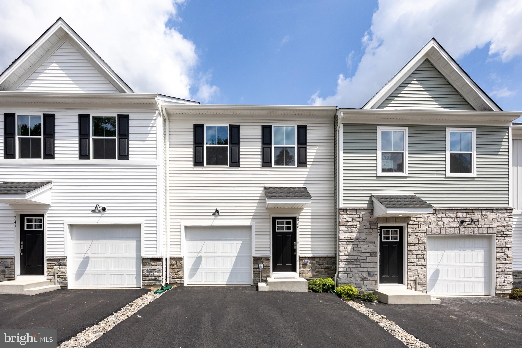 Brand New 3-Bedroom Townhome for Rent in Lennar’s Downingtown Ridge! Inside, you’ll love the wide-plank flooring throughout the main level and staircase, giving the space a warm and stylish feel. The open-concept first floor features a sleek white kitchen with quartz countertops, tile backsplash and stainless steel appliances, including a gas range. The island overlooks the great room and dining area with exit to the rear deck, perfect for relaxing with your morning coffee. There’s also a powder room for guests and an entrance to the garage with opener. Upstairs, you’ll find three comfortable bedrooms, including the primary suite with a walk-in closet and a beautiful private bath featuring quartz countertops and walk-in shower. The second floor also includes a full hall bath and a laundry area. The finished walk-out basement offers a great bonus area — perfect for a home office, workout space, or media room — with recessed lighting, exit to the rear yard and a window for natural light. You’ll also have a 1-car garage with an opener, plus driveway and community parking. All appliances are included, so you can move right in with ease! The landlord pays the HOA fee which includes lawn care and trash and the tenant pays the utilities. Downingtown Ridge offers easy access to Routes 30 and 202 and is close by the Downingtown Train Station. You're just minutes from Wegmans, parks, and all the shops and dining in Downingtown, Exton, and West Chester. Located in the highly rated Downingtown Area School District, with STEM Academy and Bradford Heights Elementary School. If you're looking for a clean, brand-new rental in a super convenient location, this home is ready for immediate occupancy. Come see it today!