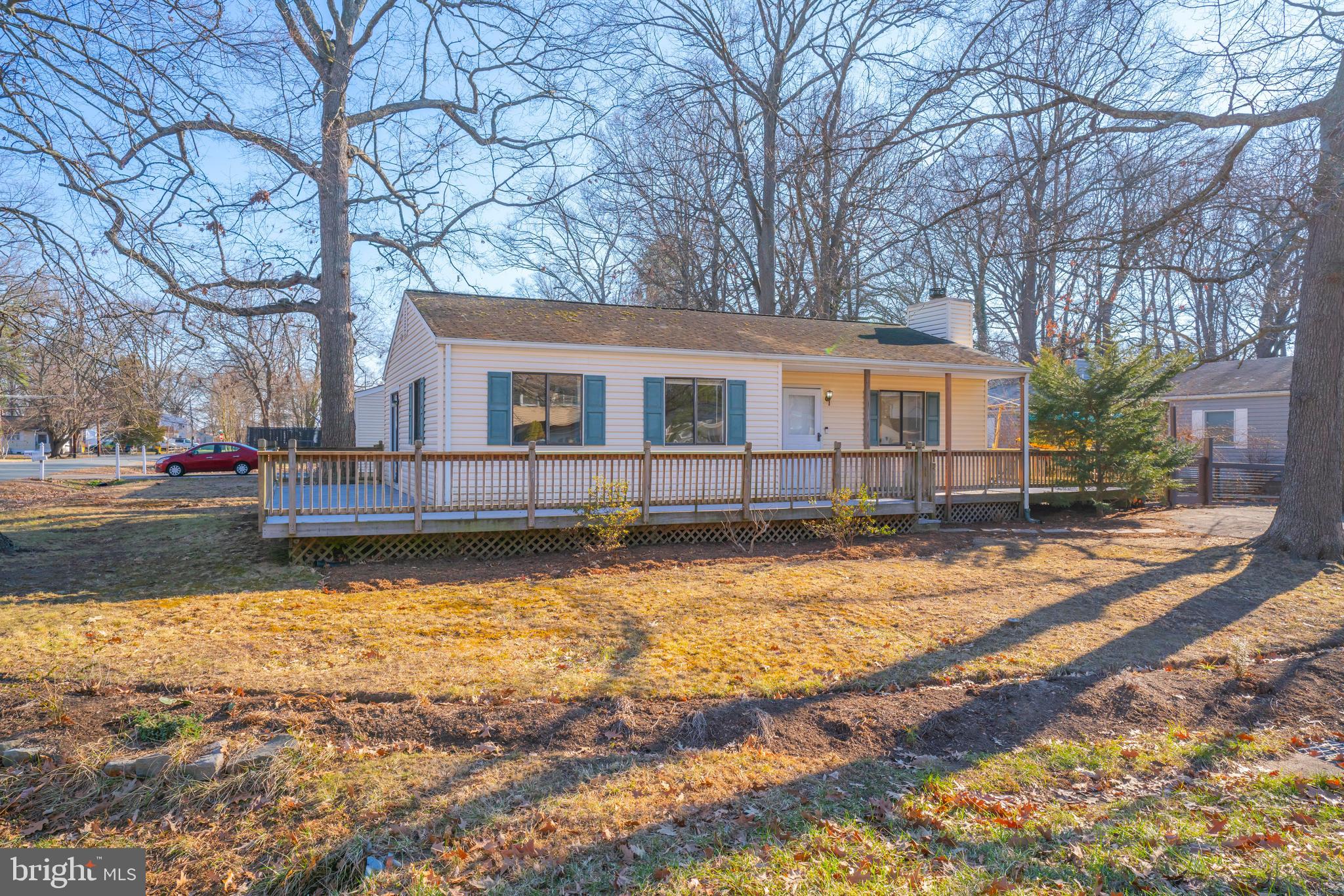 Welcome to this charming one-level home situated on a corner lot, just one block from the beautiful Chesapeake Bay and community amenities including piers, a beach, a playground, and more. The property features a spacious wraparound deck perfect for summer gatherings, a fenced rear yard with three sheds (one currently set up as a workshop). Inside, you'll find an open and inviting layout with a kitchen that overlooks a bright and sunny living room, complete with woodstove. The primary bedroom offers sliders to the deck and a convenient half bath. There’s also a full hallway bath with a tiled shower. This home is eligible for a 100% USDA rural loan. Come experience the lifestyle of Chesapeake Bay living!