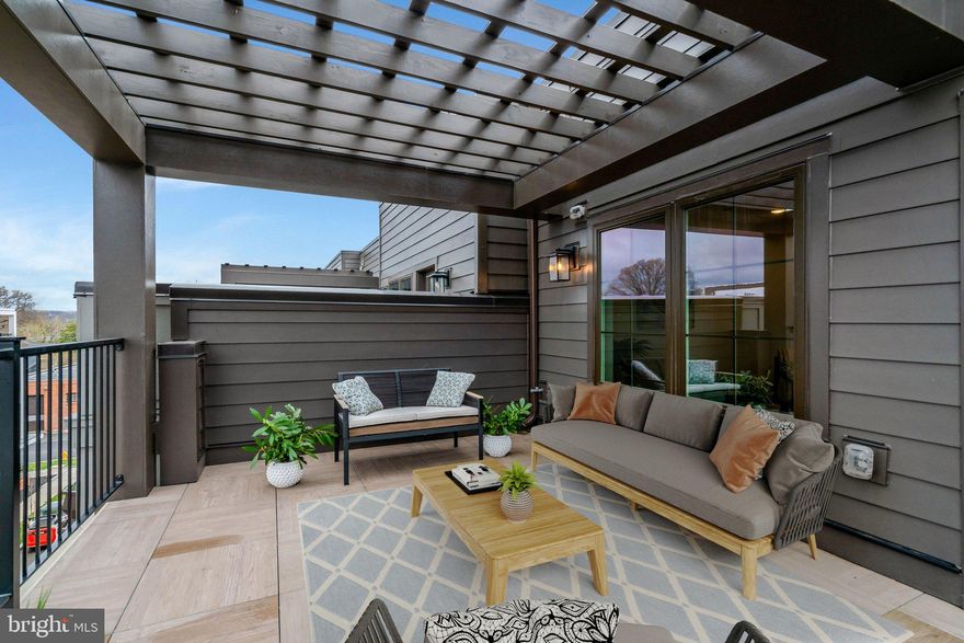 Absolutely nothing ordinary here . Brand new construction lavished with every upgrade imaginable.  Best part?  No waiting for completion - just schedule the movers.  Turn-key, quality-crafted, luxurious and stylish.  Four impeccably finished levels of thoughtful design, versatility and livability.  Four strategically located bedrooms -  each with its own full bath  plus a classy powder room on the living level.  

Eyes immediately latch onto the handsome upgraded flooring wisely extended throughout all levels.    Stunning fireplace on the open/airy living level, flanked by clever display shelving,  captures admiring glances as well -  demonstrating how glamour and usefulness can co-exist.  Welcoming heart-of-the-home kitchen with its generous island encourages gathering and lingering.  Grilling could not be easier -  kitchen door opens to a balcony fitted with a natural gas line.    

Two en-suite bedrooms on the bedroom level equally appealing with  enviably sized closets.  Spiffy laundry center on bedroom level for ultimate convienence. 

And more.  The versatile fourth level will wow you with its multi-use space.  Family room, ultra-private guest suite (B.R. #4) and roomy terrace with second gas line.    

Ceilings are 9 ft. on three levels; 8.6" on top level and the many oversized windows admit streaming natural light.  Garage for two vehicles is thoughtfully equipped with outlet for on-site EV charging.  Impressive, sophisticated and loaded with private space, entertaining space, guest space and work-from-home space.  All on a serene street a 1-3 minute stroll to neighborhood eateries clustered along Swann Avenue, a 12 minute walk to Potomac Yard Metro, 2 minutes to Oakville Park and handy to shopping, services, Pentagon, Amazon Headquarters, charming Del Ray, Old Town Alexandria waterfront and on and on...

Offers due by Noon Wednesday March 25.  Seller reserves the right to accept an offer at any time. Come see why every home in this upscale sanctuary is sold out.