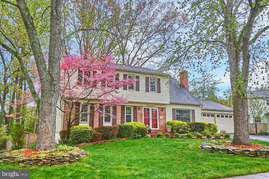 OPEN SAT, 5/1, 2-4pm, and SUN, 5/2, 2-4pm - Spectacular 3-level home coming to the market on 4/29!  5 legal bedrooms (4 bedrooms/2 baths upper), lower level has legal bedroom and full bath!  Large 2-car garage, with additional parking on driveway.   Large welcoming foyer opens to separate living and dining rooms with beautiful hardwood flooring.  Fully remodeled kitchen with loads of cabinetry and countertops, features eat in area and breakfast bar.   Eat-in area has sliding glass door to enormous deck overlooking private fully fenced backyard.  Family room, adjacent to kitchen, offers a  wood insert fireplace with brick surround.  Upper level features a large primary bedroom suite with additional office/ sitting room, several closets, and fully remodeled full bath.  Spacious secondary bedrooms offer ample closet space and new plush neutral carpeting.   Fully remodeled hall bathroom with jetted tub.  Lower level is fully finished, with a large rec room, and a 5th legal bedroom with attached fully remodeled full bathroom.  Walk out from lower level to beautiful fully fenced yard.  Loads of room for entertaining and gathering outside on the oversized deck, with step down to private patio - perfect for gathering around a fire pit!  Lower level patio offers privacy, and features an inviting hot tub!  Enjoy overlooking the wooded view from the hot tub - the backyard is private and offers lovely wooded views from every vista.   Commuter dream location!  Loads of options - just minutes from the Fairfax County Parkway, Rolling Road, a multitude of commuter bus stops in the neighborhood, an express bus directly to the Pentagon within walking distance (at the Giant), nearby slug lines in Springfield, and the Springfield Metro.   Easy access to HOV lanes both north and south on 95.   Loads of upgrades including full window replacement throughout home, remodeled kitchen, remodeled full baths, finishing basement with large rec room, bedroom, and bath, and so much more!  Roof and hot water heater (2015).  A quick walk through the neighborhood to the Saratoga Pool, for family fun and activities throughout the summer!  Membership to pool required and is not part of the HOA.  Move fast!  This lovely home has it all - incredible space and upgrades, terrific commuter options, and a fabulous community with a pool, and neighborhood get togethers year round!