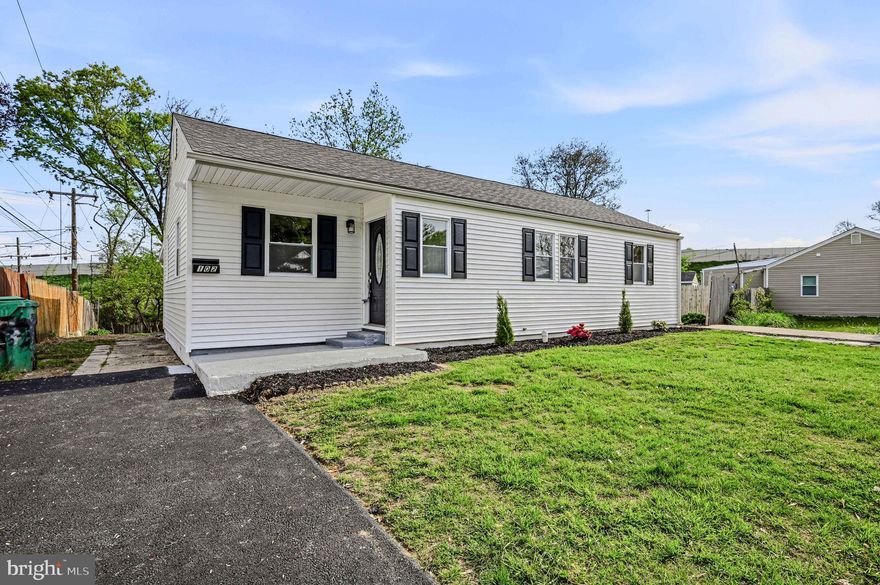 Completely renovated and move-in ready, this beautifully updated ranch home offers modern living with an open, inviting layout. Step through the front door into a spacious living room that seamlessly flows into the gourmet kitchen, creating the perfect open-concept design for everyday living and entertaining. The kitchen features a large island with seating, quartz countertops, premium white cabinetry with soft-close drawers, custom tile backsplash, and stainless-steel appliances. Just off the kitchen, the dining area provides an ideal space for gatherings.  Convenient laundry/utility room just off the kitchen. A step down from the main living area brings you to a sunken family room with direct access to the expansive backyard, perfect for relaxing or hosting guests. The home also features a fully renovated bathroom with custom tile and all new fixtures, along with three well-sized bedrooms offering comfort and versatility. Situated on a large, level lot, the property offers a large backyard and the convenience of two driveways, including one that has been newly paved. Additional upgrades include a brand-new HVAC system, ensuring efficiency and peace of mind. A perfect blend of style, function, and modern updates, this home is ready for its next owner to enjoy.