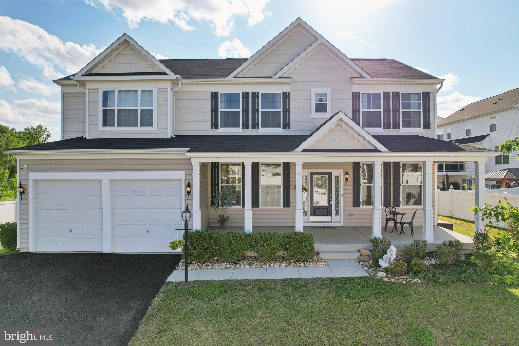 Welcome to Aerial View in the sought-after Eagles Point community, where this stunning three-story, 2020 built home awaits to tell its story. As you step onto the upgraded large front porch, imagine the possibilities that lie within this beautiful residence featuring five bedrooms and four baths.
Upon entering, you're greeted by the warmth of gorgeous hardwood floors. The open-concept main floor unfolds before you, inviting you to explore its many wonders. A separate living and dining area is the cornerstone for more private gatherings. And a two-story stone gas fireplace stands as the heart of the home, promising cozy winter evenings. The updated Family Room, with its high ceilings, is perfect for entertaining.
The gourmet kitchen is a chef's dream, equipped with stainless steel appliances, a gas cooktop, a double oven, a large center island, and ample cabinetry, seamlessly flowing into the family room, perfect for entertaining guests.
Venture upstairs to discover four bedrooms and three full bathrooms, each adorned with carpet and luxury tile. The spacious primary bedroom is a sanctuary, featuring a walk-in closet and an ensuite bathroom with a double shower, double sinks, and a jacuzzi tub, —perfect for unwinding after a long day.
Descend into the fully finished walkout basement, where a bedroom, full bathroom, and large family room await. This space is ideal for movie nights or hosting guests, with an additional bumped out area and storage room that can easily be converted into additional rooms.
Outside, the backyard beckons with its view of the water and serene privacy. Imagine sipping your morning coffee, overlooking the tranquil water reserve—a perfect start to any day.
Nestled in the highly desired Eagles Point community, this home offers access to a wealth of amenities, including a clubhouse, pool, tennis and basketball courts, walking paths, and tot lots. With its proximity to Route 1, I-95, Fort Belvoir, Quantico, Potomac Mills, Stonebridge, Leesylvania State Park, and the VRE, this location is ideal for commuters and families of all sizes and lifestyles.
Come and experience the story of this home, where every floor, every room, and every view is a chapter waiting to be lived.