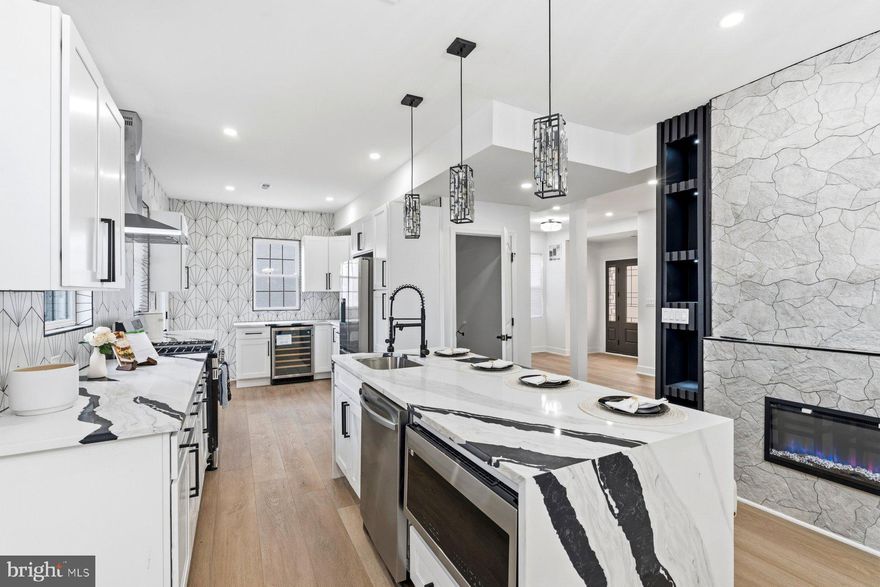 WHAT A  REMARKABLE MAJOR TRANSFORMATION - ALL WHILE KEEPING THE HISTORIC CHARM! Savor the HIGH CEILINGS  in many of the living areas.  COUNTLESS UPDATES AND CUSTOM BUILT-INS throughout  give this home the vibe you are have been looking for.  From top to bottom you will be greeted with NEWNESS AND STYLE!  This home features a totally new kitchen - GORGEOUS QUARTZ counters with an EXTENSIVE BACKSPLASH and, of course, a COLOSSAL ISLAND  - ALL SO HIP AND SO GLAM!  The DOUBLE SIDED FIREPLACE provides so much ambiance while you cook your gourmet meal and/or while you entertain guests in the living room.  There is an inviting porch off the living room and kitchen - perfect for outdoor living with new installed iron railings.    THE PRIMARY BEDROOM SHOWCASES DESIGNER TRIM COMPLETE WITH A FIREPLACE.  THE PRIMARY BATHROOM HAS IT ALL: high end design, double vanity, soaking tub , CUSTOM SHOWER AREA - AND A FIREPLACE!  The primary living space features a PRIVATE BALCONY - the perfect spot to retreat and just chill.  A SECOND BALCONY is featured on an additional bedroom on the second floor.  Worth noting - each bedroom has ample closet space and every bathroom  has been updated for modern day living,  The basement living room displays thoughtful designer trim work that contains ANOTHER FIREPLACE.   (You will also find 2 bedrooms and a full bath on the lower level.  If you need an office, home gym, music room - you name it - this home has so many options.  To top it off, this home is situated on a LARGE CORNER LOT WITH A 2 CAR GARAGE! New components include: HVAC (2 zones), windows, hot water heater, flooring, lighting  and the list goes on... Located in the Ashburton Historic District.  HURRY -  THIS HOME WON'T LAST LONG!