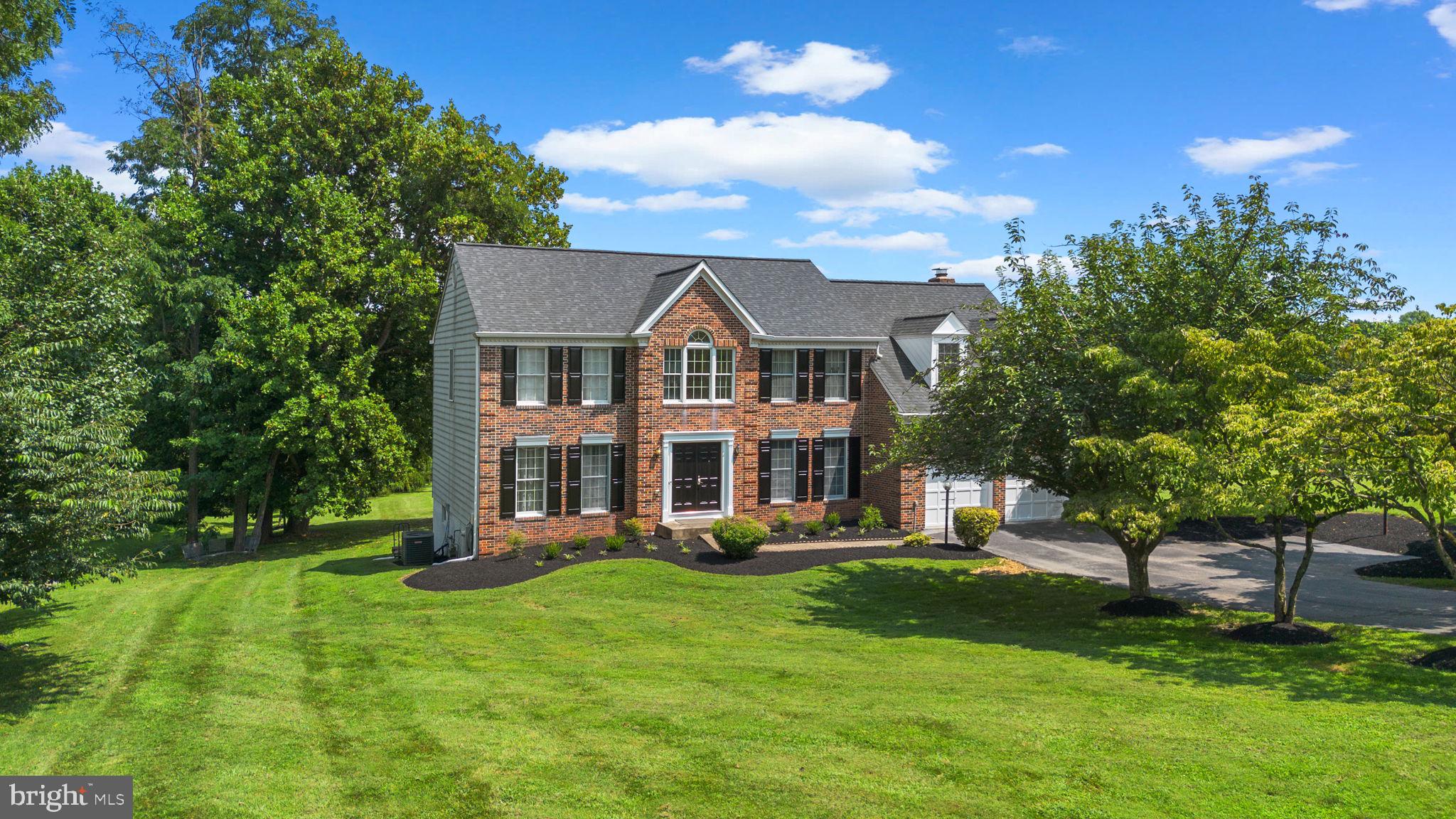 Proudly presenting 6959 Westcott Place in Ashleigh Greene! Sited on a gorgeous 3.18 acre lot, this brick-front colonial stands out as a premium offering with its stately appearance, well manicured grounds, tasteful interior updates, and exceptional interior and exterior entertainment spaces. Ashleigh Greene is known and loved for the exceptional school district, beautiful homes/yards, and the convenience of the location. While just a short drive to Maple Lawn shopping/dining, The River Hill Village Center, and major commuter routes, owners in this community benefit from spacious, private lots, and quiet, peaceful streets. This home offers a move-in ready option that can be settled quickly and that checks the boxes for today’s buyer with all of the high-demand spaces; a two story foyer, private home office, vaulted entertainment area, sizable dining room, breakfast area, second floor playroom/homework room, media room, billiards/wine lounge, a spacious primary suite, and tons of open rec space on the lower level. The backyard presents a rare opportunity to own over three acres in Clarksville. A multi-level composite deck looks out over the flat/cleared lot that is bordered by trees in the rear and that sets up beautifully for your pool, soccer field, sports court, or golf training area. ***Key Features & Highlights of this Exceptional Home*** Stately brick exterior w/ freshly painted shutters & front door (2025) -- Tree-lined asphalt driveway w/ basketball hoop & extra parking area -- 3.18 Acres of gorgeous, cleared land surrounded by trees, dream play space -- Sited at the end of a quiet, non-through street, set back from neighbors -- Two-tier composite deck w/ concrete patio in rear -- Mature/diverse landscaping, professionally prepared (2025) -- Two car, front load garage w/ newly sealed floor & painted doors (2025) -- Two story foyer -- Vaulted ceilings -- Wood floor -- Granite counters, stainless steel appliances, cherry wood cabinets -- Separate dining area, breakfast area, & bar seating -- Wood burning fireplace -- Private home office w/ French doors & extra closet space -- Floor to ceiling windows -- Recessed lightning -- Sizable primary suite w/ soaking tub & walk-in closet -- Upper level living room/play room or bonus bedroom -- Large basement recreation area, space for home gym, media room, and guest room -- LVP floor in basement -- Full bathroom in basement -- Above grade walkout in rear of home -- Billiards area w/ professional quality wine storage -- Partially finished storage space -- Architectural shingle roof (2019) -- HVAC Replacement (2021) -- Wood frame windows -- Water heater replacement (2018) -- Front door/back door/gutters replacement (2021) -- Dishwasher replacement (2024) -- Well pump replacement (2019) -- Septic pumped July (2025) -- Hurry, do not wait!