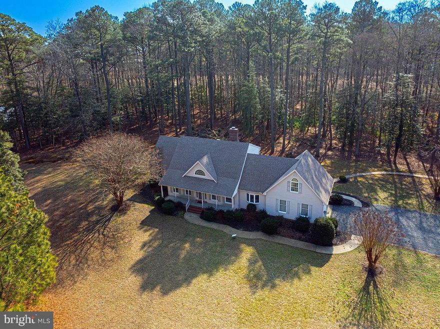 Price Adjustment! Discover the beauty of country living on this sprawling  20+ acre estate, ideal for fishing, hunting, and embracing the great outdoors while savoring the beauty of nature for you to embrace the vibrant life you truly deserve.  This beautiful 2 level home boasts three bedrooms, two and a half baths, and a versatile bonus room. Enjoy the spacious formal living and dining rooms, as well as a cozy great room featuring a Harmon pellet stove with a charming mantle surrounded by shiplap. The kitchen features modern appliances and stylish undermount lighting, while the kitchen bay window offers a picturesque view of the serene natural surroundings.  A delightful breakfast room opens up to a screened-in porch. ideal for relaxing evenings with your favorite beverage. The primary suite is conveniently located on the first floor and includes a luxurious jetted tub, dual vanities, and a newly updated stand-up shower with modern framing and doors. Additional property upgrades include contemporary lighting and ceiling fans on the second floor bedrooms, walk in attic, a tankless water heater, a water treatment system with both salt and chlorine options, reverse osmosis water filtration system and new outdoor lighting. Enjoy enhanced connectivity with a commercial cell phone booster and Starlink internet service. This home features an oversized two-car garage and a circular driveway, and flood insurance is not necessary. An existing security system is in place but not currently active. Conveniently situated just 10 minutes from Snow Hill and a short half-hour drive to the sandy shores of Ocean City, Maryland, this property offers the perfect blend of tranquility and accessibility. This property has everything you need and is competitively priced for a quick sale. Don’t miss out—call now for your private tour!