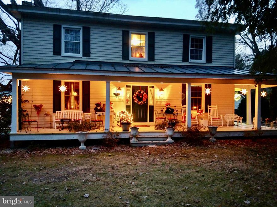 Tucked on nearly 8 acres in Bumpass, this thoughtfully renovated circa 1880 farmhouse offers a rare blend of character, space, and flexibility. Expanded in 2005, the home features over 3,100 square feet with a versatile layout including 3 primary suites (or 4 bedrooms) and 3.5 baths—ideal for a variety of living needs.

Original details like heart pine floors, antique mantels, doors, and hardware have been preserved, while meaningful updates provide comfort and function. The kitchen is both inviting and practical with Zodiaq Quartz counters, double ovens, gas cooktop, stainless appliances, and abundant cabinetry with pullouts, opening to a bright enclosed sunroom and outdoor living spaces.

Porches on multiple sides, a rear deck, outdoor fireplace, and hot tub (conveys as-is) create inviting spaces to relax and gather. The land itself is something special—open and usable with mature trees and landscaping, laden with perennials, fruit-bearing plantings (grapes, figs, pear), raised beds, and a striking 200+ year-old oak anchoring the setting.

With A2 zoning and numerous outbuildings including a barn, smokehouse, and additional structures, this property offers opportunity for hobbies, projects, or simply enjoying space and privacy. Additional highlights include zoned HVAC, updated electrical, replacement windows, and a 4-bedroom septic system.

Convenient to Lake Anna (Pleasants Landing nearby) and accessible to Richmond and Fredericksburg, this is a property that offers both a sense of retreat and everyday practicality.