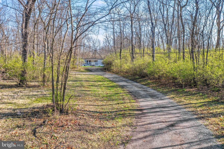 Welcome to 151 Franks Rd! This awesome property is ready for its next owner! Featuring a 2 Bed 2 Bath Single Wide mobile home, a wooded 3.57 acre lot, No HOA, and a Huge 29' x 36' Detached Shop. The shop is already equipped with a 220 amp breaker & air lines. Bring your compressor/tools and you'll be ready to go! Only minutes from Inwood and even closer to I-81. This one won't certainly last long, Schedule your tour today!