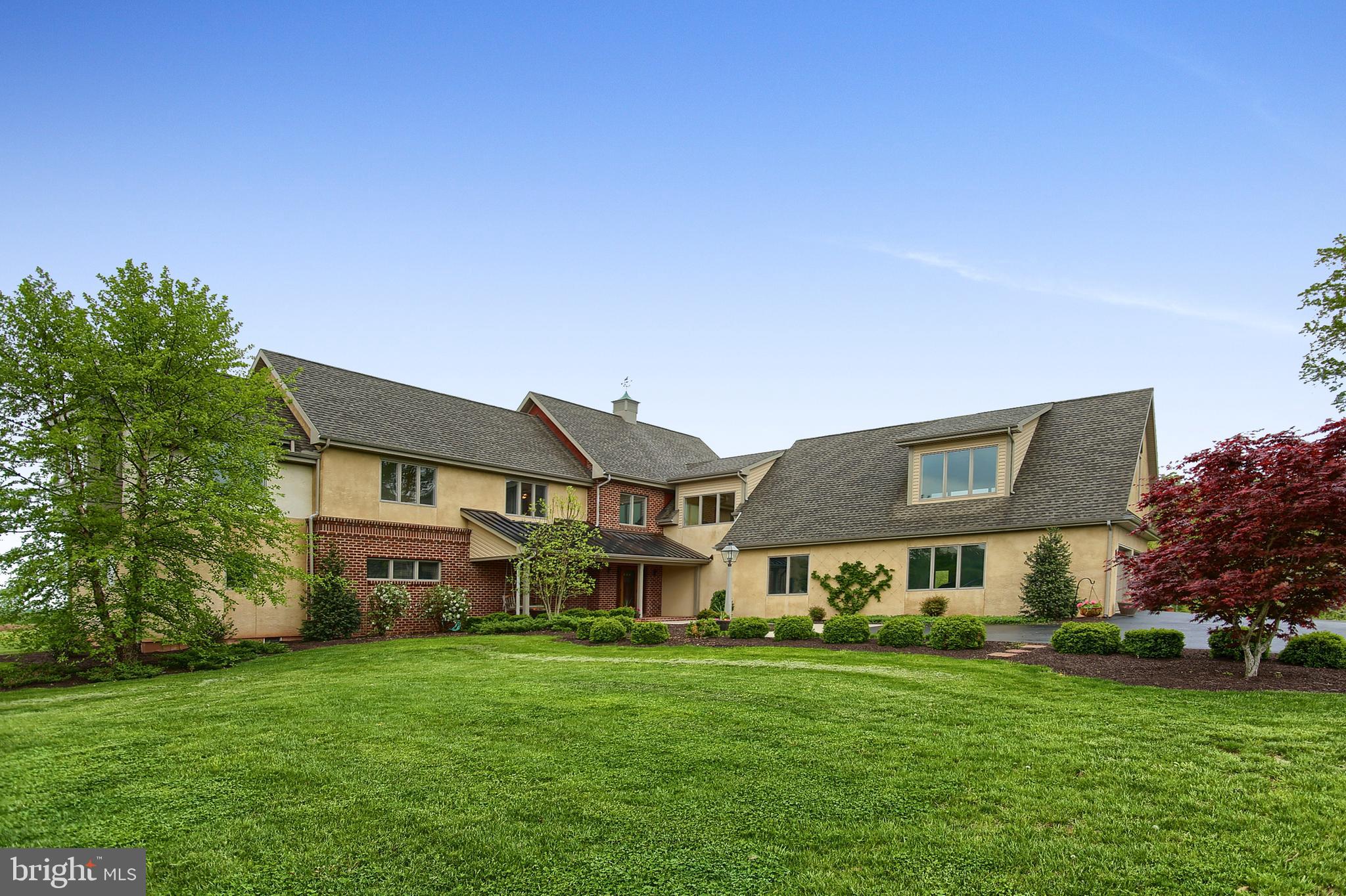 Cartref Farm is a magnificent 121-acre farm estate located in Newberry Township, York County, half-way between Harrisburg and York, Pennsylvania. A paved drive enters the property to arrive at an attractive 7,000 SF home. In perfect harmony with its surroundings, the main house overlooks a pond, in-ground swimming pool, historic bank barn, a stream, acres of pastures, and a 1,400 SF caretaker's house. FARMSTEAD STYLE WITH 21ST-CENTURY LUXURY - Built in 2012, the main residence has been designed to high standards. The interior is characterized by warm and inviting living spaces with classic architectural elements, such as 10-foot-high ceilings, interior brick, reclaimed oak hardwood flooring, and cherry kitchen cabinetry. The residence offers ample opportunities for grand-scale entertaining indoors and out, on the screened-in porch or outdoor patio that overlooks 10 acres of woodland. LIVING AND ENTERTAINING SPACES: FARMHOUSE FEEL WITH ELEGANCE - Visitors are welcomed warmly into the home on the covered full brick front porch. Once inside, the brick interior walls bring a sturdy farmhouse feeling. The two-story great room is graced with a floor-to-ceiling native stone fireplace, soffit lighting, large windows overlooking the pastures and woods and expansive space. Adorned with oak hardwood flooring reclaimed from a barn in York County, the great room transitions seamlessly to the double island kitchen. The former is warmed by a wood fireplace, while the latter has large double islands and a walk-in pantry. Complementing the main level is a music room or study with an exquisite ceiling and custom cabinetry, a three season screened-in porch, and a luxurious master suite. RETREAT TO PRIVATE QUARTERS - The main level includes a laundry room, two powder rooms, and a mud-room with access to a covered porch and oversized three car garage. Upstairs, the spaciousness continues with four bedrooms, each with a full bath, a 5th bedroom/children's study/play room, laundry room, an unfinished bonus room and abundant storage. The lower level basement is unfinished but includes Bilco door access to the outside. GROUNDS FOR RELAXATION AND ENJOYMENT OF NATURE - A 1/4 mile driveway assures privacy and introduces this beautiful property. Set amid more than 121 acres of picturesque grounds, Cartref Farm is a recreational idyll. The spring-fed pond is stocked with fish. Two streams traverse the length and width of the property and approximately 10 acres of woods provide a beautiful natural setting. The 20x40 inground salt water pool features an enclosed pump house and pool house with changing room. THE GENTLEMAN FARMER OR EQUESTRIANS DREAM - Cartref Farms grounds are arrayed with a host of amenities designed for the gentleman farmer or equestrian. The recently renovated bank barn includes 4 stalls and ample storage for farm equipment, tools, hay, feed and tack. The barn includes attached tractor stalls with automatic overhead doors and tanks for diesel fuel and gasoline. EXTRAORDINARY AMENITIES - A superb array of amenities and features are found throughout the estate. Supporting the property is a charming 1,400 SF guest house/caretaker's residence. Other ancillary structures include a separate hay storage barn. Designed for contemporary living, Cartref Farm is equipped with 21st-century amenities: Highlights include radiant floor heating and designer lighting, geothermal heating and cooling, Rinnai instant hot water heaters (2), a 1,000 gallon in-ground propane tank, emergency generator, and security and fire alarm systems. Property IS subdividable. Only 5 miles away from the Capital City Airport, CXY, 16 miles to Harrisburg International Airport, MDT. Easy access to the PA Turnpike.