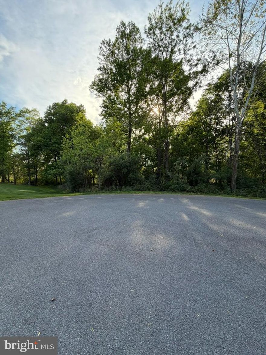 Are you looking for the right place to build your dream home? Welcome to the highly sought after Westwood Manor subdivision! This wooded 1.44 acre lot is in a prime spot and located on a cul-de-sac at the end of the street. This well established community has low HOA fees, minimal restrictions, and rural vibes while still offering close proximity to I-81 and shopping and dining in Martinsburg.
