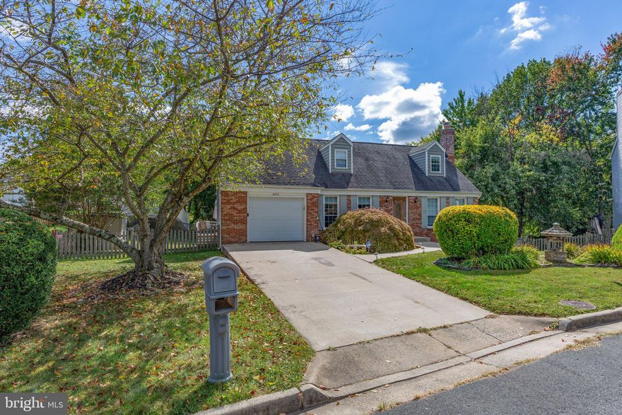 This beautiful cape cod has a huge yard and is located in a cul-de-sac with updates galore.  Main level features hardwood and ceramic tile flooring, fresh paint, third bedroom, full bath and absolutely stunning, updated kitchen.  The kitchen offers wood cabinetry, granite countertops, cooktop, updated faucet, decorative backsplash and a planning desk area. Upper level has large master bedroom with spacious walk in closet, full bath with dual shower heads and large second bedroom.  4th Bedroom in basement NTC,  large family room with brick fireplace and updated floor. Walk out to the large fenced in backyard. New recessed lighting throughout. Definitely a gem in Dale City close to Potomac Mills Mall, shopping & dining.