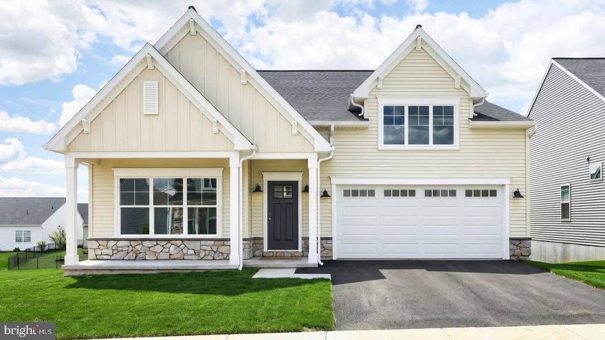 This charming 1-story home with a welcoming front porch includes a 2-car garage and 9’ ceilings. The garage opens to a mudroom entry with a built-in bench and access to the laundry room. Beautiful vinyl plank flooring flows throughout the main living areas. The kitchen is well-appointed with enhanced appliances, quartz countertops with a tile backsplash, a spacious pantry, and a large center island, which opens to the great room. The kitchen and great room share a cathedral ceiling with a wood beam accent and a cozy gas fireplace with floor-to-ceiling stone warms the space. A sunny dining area with triple windows provides sliding glass door access to a screened in composite deck. To the rear of the home, the owner’s suite features an expansive closet and a private bathroom with a tile shower and double bowl vanity. A second bedroom, full bathroom and versatile flex room are found at the front of the home. Images may include virtual furnishings for illustrative purposes only.