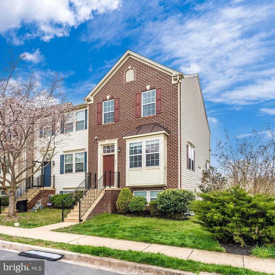 Stunning end unit brick front townhome boasting updates throughout. Gleaming hardwood floors, neutral color palette, custom window coverings, open concept floor plan,  and light-filled interiors! Living room graced with crown molding and lofty windows; Dining room embellished with chair railing and crown molding; Eat-in kitchen highlighted with oversized custom designed center island and new shaker cabinets, premium sleek appliances, quartz countertops, breakfast room, and easy access to the deck; Primary bedroom adorned with soaring vaulted ceilings and en-suite full bath; Two additional bedrooms and a full bath complete the upper-level sleeping quarters; Lower LeVeL recreation area  with LARGE open airy space, full bath, and access to the fenced backyard; The exterior features landscaped grounds, deck, fenced backyard, sidewalks, and streetlights; Recent updates: New Shaker Kitchen cabinets, appliances, center island, quarts countertops, ROOF is brand NEW, painting, and landscaping.  A MUST-SEE!