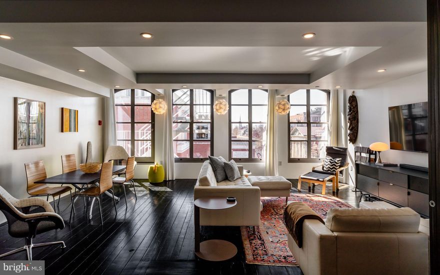 Experience this stunning luxury condo with unparalleled design, the epitome of modern living. This recently completed one-of-a-kind condo was architect designed and meticulously maintained. A dramatic 2-bedroom, 2-bathroom residence, where pride of ownership is truly evident. Nestled in the heart of Old City, this property is surrounded by the rich history and vibrant energy of the city’s renowned Historic District. Upon entry from the private elevator with direct in-home access, you will be greeted by an open floor plan featuring translucent RayDoor Movable Walls at both ends of this rectangular space. These 3Form recycled panels, allow you to transform spaces. The minimalist chef’s kitchen has a stunning salvaged wood island created from one of the original beams from the 1840s building and European cabinets with Bertazzoni & Verona appliances. The wide floor plan with exceptional southern and western windows light up the space. The center of the home  features a bedroom, den, laundry & Japanese style bathroom with a steam shower, heated floors & teak seats. The Primary bedroom with white greek marbled floor is a retreat: a striking glass fireplace, set atop a natural river-rock base and 200-year-old cured mantle, creates an ambiance of warmth and refinement. Indulge in spa-like tranquility in the sueded Italian-tiled bathroom, with 5-ft radius shower, floor drains & Starck soaking tub. A floating TOTO toilet adds to the modern aesthetic + radiant heat from bedroom floor thru to inside the circular shower! With cobblestone streets, charming boutiques, acclaimed restaurants, and a thriving art scene, Old City offers and unparalleled urban lifestyle in one of Philadelphia's most sought after neighborhoods. The Seller will be providing 1 year pre-paid parking at a nearby lot (and will need to be noted on the agreement of sale). Taxes and square footage are the responsibility of the buyer to verify independently.