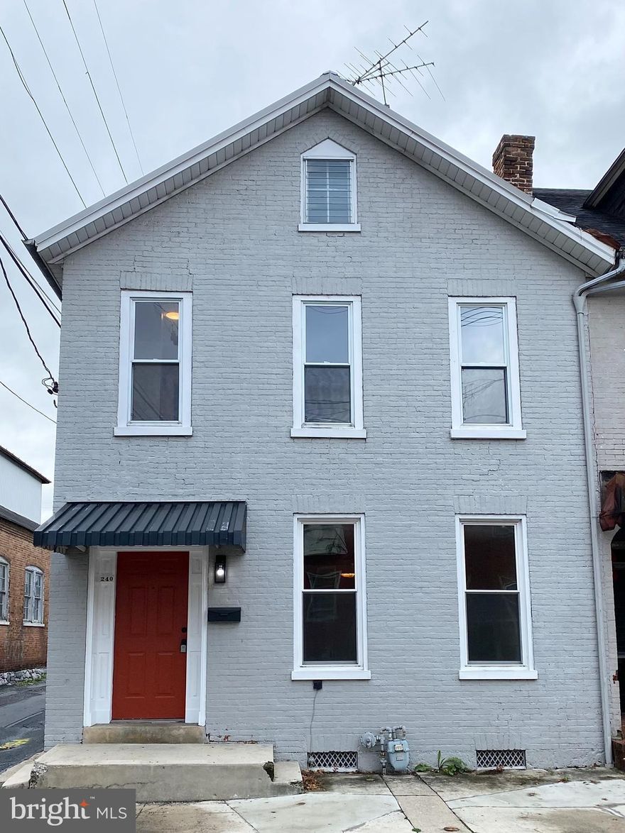 FULLY RENOVATED BRICK COLONIAL! This 3 bedroom 1 bath home features: hardwood floors through out; updated kitchen with quartz countertops & LVP flooring; cozy living room with decorative fireplace; separate dining room; hardwood staircase with beautiful banister; nice-sized bedrooms; updated full bath with tub-shower & ceramic tile floor; washer & dryer hook-up on main level; full attic with fixed stairs; replacement windows; metal roof; and more.  Convenient borough location and setting on a lot with off street parking.