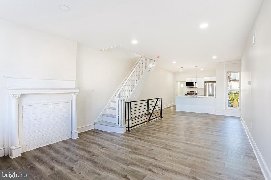 Welcome Home to this unique property. Enter the light-filled great room and enjoy the abundant open floor plan with recessed lighting and neutral color scheme throughout. The streamlined kitchen features soft-closing white shaker cabinets and drawers, granite countertops, a tile backsplash, and stainless steel appliances. A full bathroom with shower completes this level. Upstairs are three generous bedrooms and a spacious hall bath.  Both bathrooms in the home feature custom tile work and vanities.  The fully finished basement completes the home.  This property offers exceptional amenities and is well-situated.  Homebuyer Access Grant available to qualified buyers.