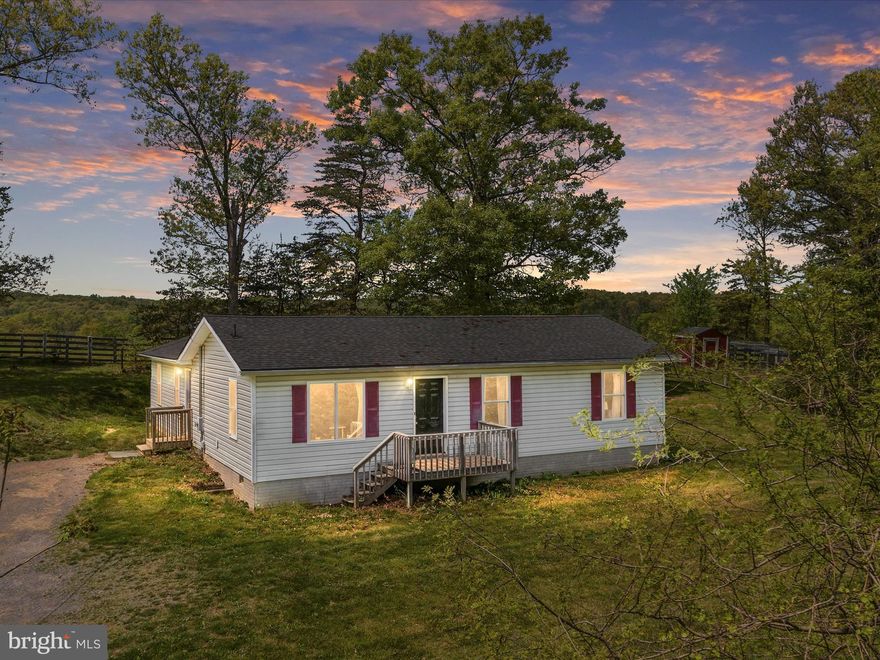 Welcome home! Over 3 1/2 acres w/nice ranch.  4 Bedrooms, 2 1/2 Baths.  Open flow to home and awesome, private setting.  Only 3 miles to Slanesville Elementary.  19 miles from 522N. Walk to the little tavern w/excellent food. Property is mostly wooded. Backs to a large farm and gorgeous sunsets. Private, yet very convenient to major routes. Sheds/Buildings are sold "as is". Property shows well. Patio out back. Current internet is Starlink.  But DSL Fiber is coming.  This would make a wonderful first home. 1700 sq. ft. of living space.  All appliances convey. Welcome HOME!