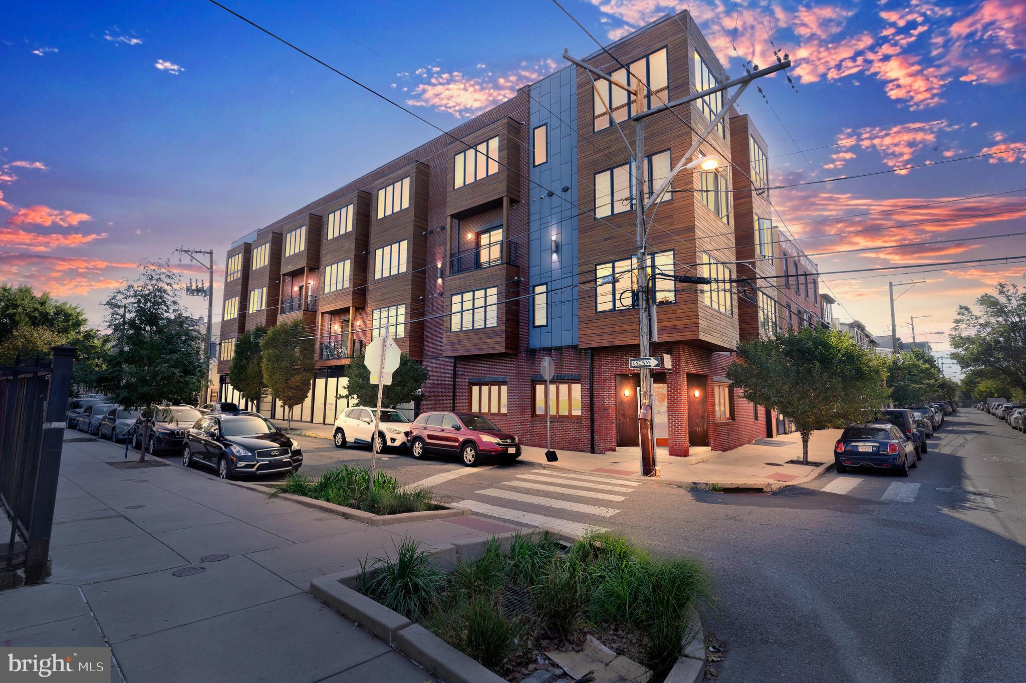 The perfect blend of zen and luxury, The IceHouse Condominiums is a pet-friendly, LEED Platinum Green building featuring beautiful courtyards, a koi pond and a community dog park. These sleek and modern condominiums were built in 2016 so have the remainder of the 10-year tax abatement along with low low condo fees. This gorgeous one-bedroom CORNER unit has a PRIVATE ROOFDECK and is one of only two with 11-FOOT CEILINGS. It is complete with red oak hardwood flooring, recessed lighting, exposed ductwork, oversized casement windows and a private roof deck with 360-degree views. The open concept floorplan is bright and spacious with a handsome living/dining area that flows into the ultra-sleek kitchen featuring 2-inch thick Quartz countertops and island with pendant lighting, espresso hued flat-front cabinetry, honed Carrara marble backsplash and upgraded GE Profile stainless steel appliances including a 5-burner slide-in range. Just off the kitchen, there is a convenient coat closet along with a spacious storage closet/pantry and utility room that houses the full-size front-loading GE washer and dryer. Down the hallway from the main living/dining area is a spa-like bath with a unique concrete countertop, dual faucets and a custom glass tiled shower with frameless glass door. The oversized bedroom is spacious enough to include a small office area and has a large walk-in closet as well. The bedroom opens out to a balcony which has a staircase leading up to the roof featuring a wooden deck for entertaining surrounded by gorgeous sedum and other maintenance free vegetation. From this fabulous Fishtown location you are perfectly situated to all the hot spots along Frankford & Girard Aves including Middle Child Clubhouse, Reanimator Coffee, Fabrika and Lloyd. Commuters will appreciate easy access to I-95, I-676, the El Train system along with multiple bus lines. Don’t miss this sexy and spacious condominium!