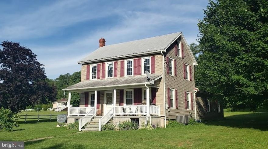 4 bedroom, 2 bath Farmhouse sitting on over 4 acres surrounded by gorgeous mountain views. This 1758 sq ft home features first floor laundry and master bedroom with a large walk in closet. Oak cabinets by Rosewood Kitchens featuring pantry & island. Remodeled in 2013!! Hardwood floors throughout much of the home. Updated hot water heater, wiring, windows, heat pump & central air. New septic about 5 years ago. All kitchen appliances stay! Workshop, carport & building used to house goats with electric fencing. Over 2 acres wooded & 1 acre undeveloped. Enjoy quiet country living!