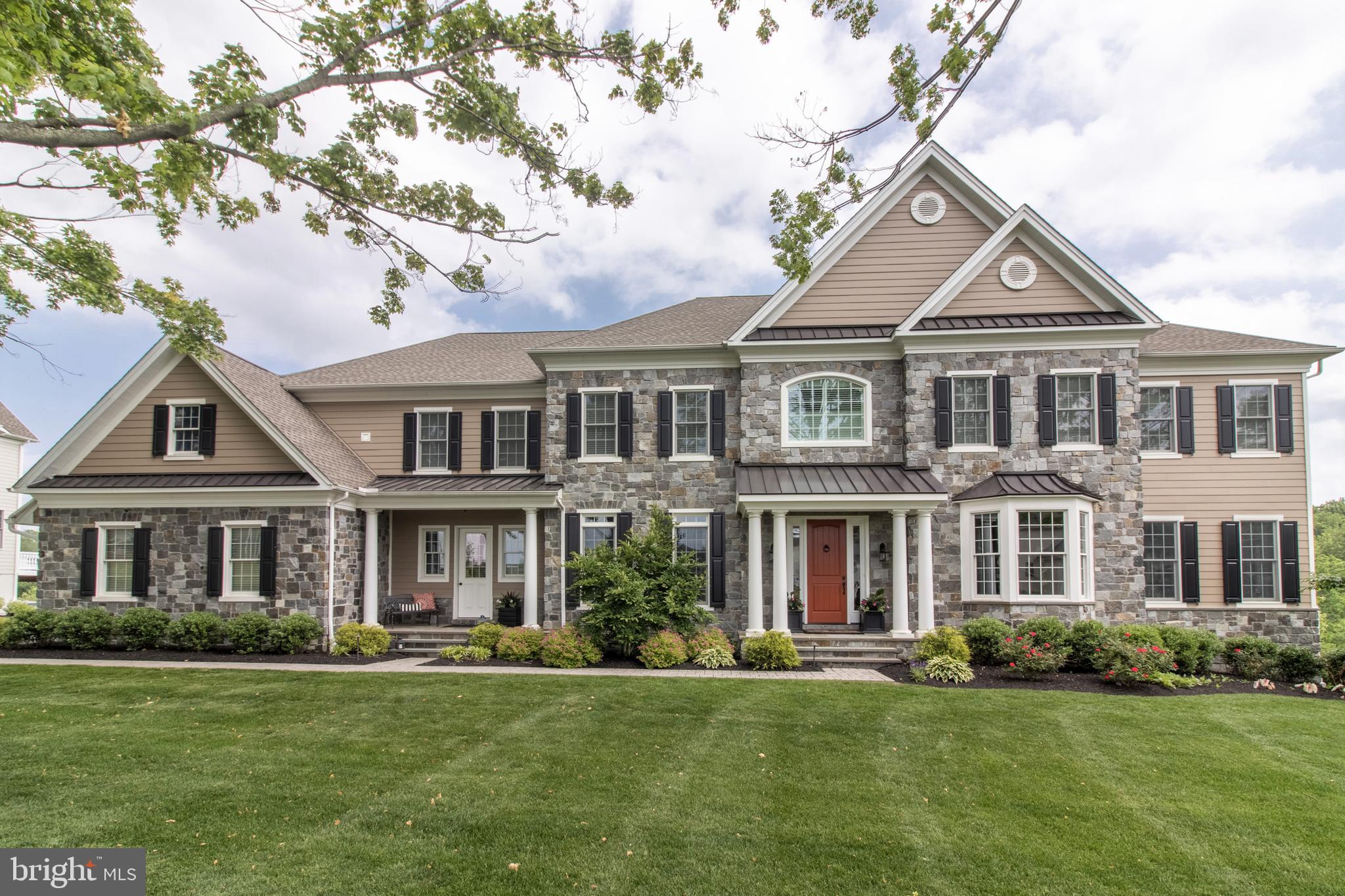 Welcome to this magnificent home in the desirable estate section of the coveted Liseter community. Set amid the bucolic Newtown Square countryside, private wooded views abound from the expansive deck and nearly every room of the house. Inside the exquisite 5 bedroom, 5 1/2 bath stone home, you are greeted by an elegant center hall foyer with inviting entryways. The tray ceiling entry complimented with dark hardwood floors that expand throughout the home introduces the excellent flow and floor plan. Formal living and dining rooms adjacent to the hall which leads to the large chef s kitchen! The well appointed gourmet kitchen with custom cabinets includes a 60 Wolf Range, paneled Sub Zero refrigerator, two dishwashers, built in microwave, beverage center and bar. The large kitchen island is the centerpiece of the main floor opening to the breakfast room, planning center, powder room and spacious family room with fireplace. Quietly tucked behind the family room is a private office with built in bookcases and deck access with a beautiful view. An expansive deck area with stairs leading to the backyard is great for all of your entertaining needs and watching evening sunsets! The mudroom provides access to the 4 car attached garage and a second entrance. Rounding out the main level tucked on the other side of the home is a private main floor guest suite with well appointed full bathroom and a beautiful sun room perfect for relaxing or family game night!The second floor has 4 additional ensuite bedrooms, large closets and a spacious laundry room! The luxurious master suite features a large bedroom, private sitting room, 2 walk in closets and spa-like bath featuring his & her vanities centered by an oval jetted spa soaking tub and oversized glass shower. The large unfinished walk out basement offers full size windows and unlimited potential for future finishes that you may desire. The Liseter community has upscale amenities including an infinity pool, fitness center with classes, tennis and sports courts, walking trails and a 9,000 SF preserved barn serving as a second Clubhouse. This spectacular home is perfectly situated in a very desirable location convenient to the airport, corporate centers, Episcopal Academy and the new Whole Foods in Newtown Square! All Main Line towns, schools, shops, restaurants, the train and major routes are also nearby. Do not miss your opportunity to own this incredible home!