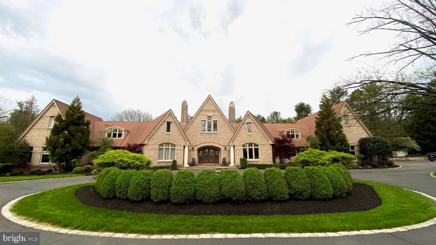 Perfection awaits the perfect buyers.  This Whitemarsh estate  was perfectly placed on 5.7 acres and the large amount of  construction plans and drawings  show how much detail went into the engineering and constructing this solid work of art.  8500 SF of finished space with an additional 3500+ unfinished. 
This magnificent warm home has  multiple living areas  along with an attached 2 bedroom Guest Suite. Which can be entered privately. Guest suite has two bedrooms and an additional room and a full bath. Ideal for a nanny, quests or additional office work spaces.  This home was designed for entertaining. 
The core  is a magnificent two story Great Room.  Highlighted with soaring ceilings, beautiful moldings, large picture windows, amazing natural light and a wood fireplace. Built and designed to an exact standard of perfection, the exquisite architecture, craftsmanship and exquisite floor to ceiling  millwork can not be compared.   Just off the gourmet kitchen, is a  first floor family room that is perfect for gatherings. French doors allowing both rooms to open wide to a beautiful landscaped property for outside entertaining.  The bright sun filled kitchen with breakfast nook, island seating, radiant heated floors, walk-in pantry and stainless steel appliances include: Wolf stove & ovens, 6 burner range, 2 dishwashers and a Sub Zero refrigerator. A  billiard room that can easily be a office, bedroom, exercise room  on the first floor.   The first floor Master suite with fire place, vaulted ceilings,  sitting area, large custom dressing room and spectacular bath is a must see.  Double custom marble top vanities, tub, and a double doorless overhead rain shower with a window that looks out upon the mature property grounds.  You will feel like you are at a retreat.  Additional bedrooms on first floor all have full bathrooms with heated floors. Second Floor Features: Theatre room  with surround sound and rows of reclining seats. Relax and enjoy a night at the movies.  A second family room, computer work area and a half bath.  Second floor office over great room  with spectacular views and custom built ins. Two stairways to the Second Level.   The additional unfinished area has endless possibilities. Basement: Double wide doors walkout to yard.  High ceilings and a cement ramp. Wheel in the big toys!  Ideal property for someones:  HOME OFFICE, STUDIO, HOBBY, DREAM GYM. WORKSHOP.    The  quality construction and attention to detail throughout this home cannot compare.  3 car garage, circular drive, "ENTIRE" House generator, 5 zone heating.    The location is notably the best outside of Philadelphia in Montgomery County.  You have an easy commute to center city and access to airports and major highways.   Award winning public schools and prestigious private schools within miles. House was unavailable for showings for over over 6 months during pandemic and while seller's children were home from college.  This is one of those homes that you must see in person to feel the magnitude and appreciate the quality craftsmanship and materials used in the building of this rare gem.  Appointments for qualified and serious buyers.