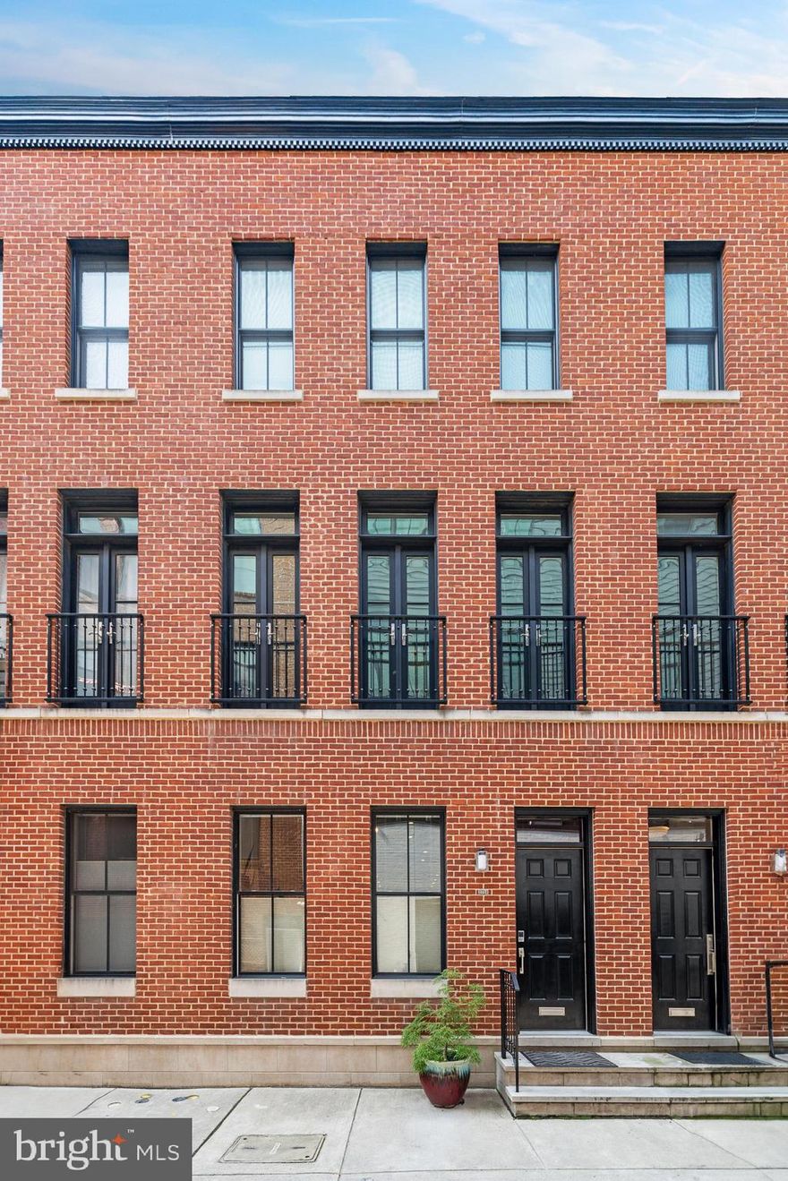 Luxurious Living with Tax Benefits & Prime Location! 

Welcome to this spectacular residence, a home that captivates with its exquisite design and architectural details at every turn. Boasting an impressive 10' 9" high ceilings, custom wide plank oak flooring, and a thoughtfully designed staircase, it emanates an aura of grandeur and sophistication.

Walk into a sunlight-drenched, sleek kitchen equipped with top-of-the-line appliances including an integrated refrigerator, Bosch dishwasher, and a stainless steel Jenn Air range/oven. A minimalist design aesthetic is maintained with concealed outlets under-cabinet lighting. The large marble island, adorned with pendant lights, serves as the centerpiece, inviting both culinary creativity and social interaction.

The powder room impresses with its floating Krion sink, brass wall-mounted plumbing, and a stylishly tiled back wall. Upstairs, the expansive master suite is a private oasis, featuring a bespoke walk-in closet and a luxurious master bath equipped with wall-mounted double vanity, a Krion soaking tub, and a frameless glass shower.

Beyond the master suite, discover a versatile office/den space or private library, accentuated by a wall of French doors. The 3rd floor offers a suite with a private bathroom, an additional spacious bedroom, a full hall bath, and a bonus room perfect for a nursery, second office, or yoga room. A stylish hall bathroom sits conveniently between the two bedrooms, featuring a deep soaking tub.

Your living space extends outdoors with an expansive rooftop deck, offering breathtaking city views, perfect for entertaining or simply soaking in the sunset. The home is completed by a finished basement with high ceilings, a separate laundry room, and ample storage space.

For your comfort and energy efficiency, this home is equipped with a dual zoned HVAC system. Plus, enjoy the convenience of off-street parking and 4 years remaining on the tax abatement.

Located just off Fairmount Ave, this home is within a stroll's reach of the new Whole Foods, Target, vibrant bars, delectable restaurants, a plethora of shopping outlets, and is just blocks away from the Fairmount subway station. Experience city living at its finest with the convenience you've always desired. Your dream home awaits!