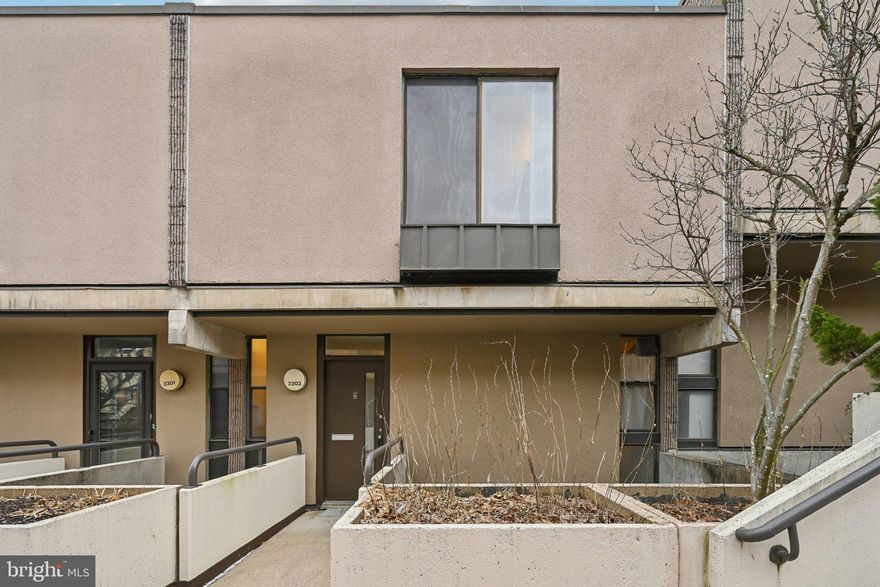 Welcome to 2303 Bayleaf, a beautiful condo, nestled within serene “Garden within a city”.  This contemporary condominium was designed by renowned architect Moshe Safdie. It offers a distinctive design, thoughtful updates, and low maintenance living in a prime urban location. Conveniently situated minutes from downtown Baltimore and major employment centers including Johns Hopkins University and University of Maryland, Baltimore.

The main living level features an open, light-filled layout with vaulted ceilings, natural cork flooring, which is easy on joints, and a seamless flow between the spacious dining area and living room. The recently redesigned IKEA kitchen offers a bright, modern aesthetic with ample storage and workspace.
The upper level includes three generously sized bedrooms, including a primary suite with an en-suite bathroom. The lower level features a dedicated laundry area and direct access to the attached parking garage.

In 2019, the home underwent extensive renovation, including partial demolition and reconstruction, resulting in updated interior systems, finishes, and appliances. The improvements include low-VOC paint and cabinetry, updated electrical panel (2022), a new refrigerator (2025), washer (2023) and dryer (2021) and flooring throughout. In 2026 the entire unit was painted with eggshell/satin paint for durability and ease of maintenance.  

The South-facing orientation provides abundant natural light throughout the day, while mature landscaping enhances the surrounding views and sense of privacy.

The monthly HOA fee includes water and sewer, exterior building maintenance (including roof), snow removal, and maintenance of common outdoor areas. Association financial information provided indicates a strong reserve position as of 2026.  Historically, the world-renowned Waldorf School, located moments away, offers residents a 10% discount on tuition.  Buyers are encouraged to verify all HOA details.

Owner occupants are eligible for two attached, sheltered parking spaces while tenants are eligible for one parking space, with additional unassigned street parking available.  Community amenities include a pool, tennis courts, playground, clubhouse, and walking trails. This home offers a prime location, many amenities, and the peace of mind of a well upgraded home.