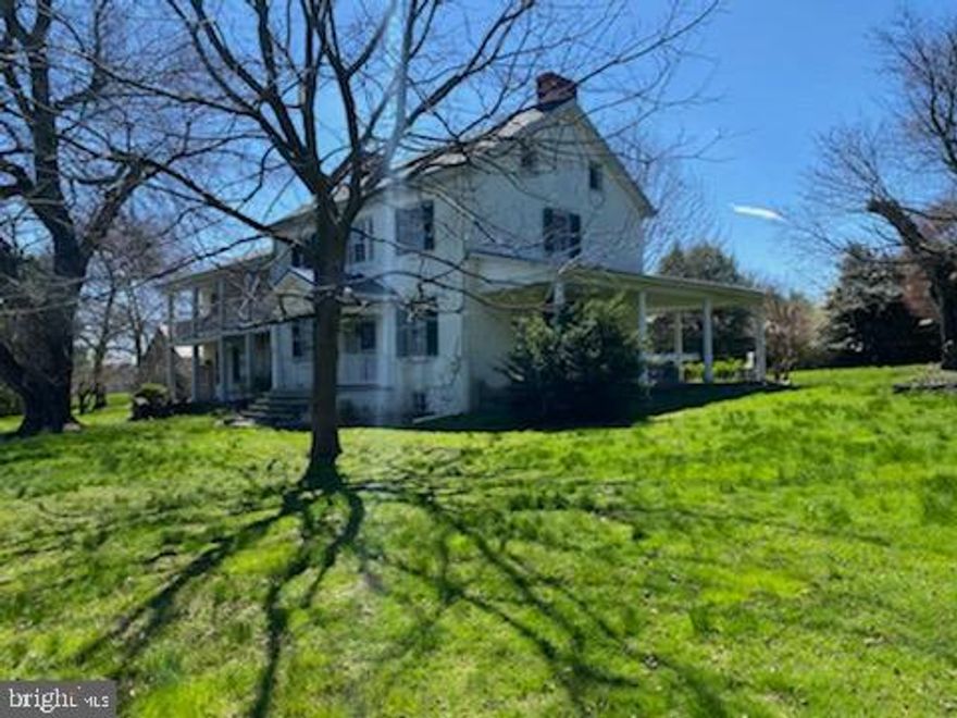 This majestic american farm house dates back to the start of the United States.  There have been 2 large additions over the early years.  There is a large wrap porch on the west side of the house.  There are 2 porches each on the first and second floors of the east side.  There are 7 bedrooms and 3 baths inclusing 1 in the separate apartment in the main house.  There are 2 kitchens on the main floor.  The approximate sq footage of the main house is 4300.  The exterior of the main house is stucco that is probably over stone and the newest section is siding.  This home could be restored to become a stately manor house.

The additional structures are a tenant house with 3 bedrooms and 1 bath in approximately 1700 sq ft.   This home also has modern drilled well and septic.  There is a modern pole barn that is 50 x 100.  It could be adapted to any ag. usage.   There are also a 30 x 60 and 24 x 45  ag usage buildings that could be adapted for whatever ag. use the buyer wishes.  Most recently they have been used to store equipment and agricultural goods.