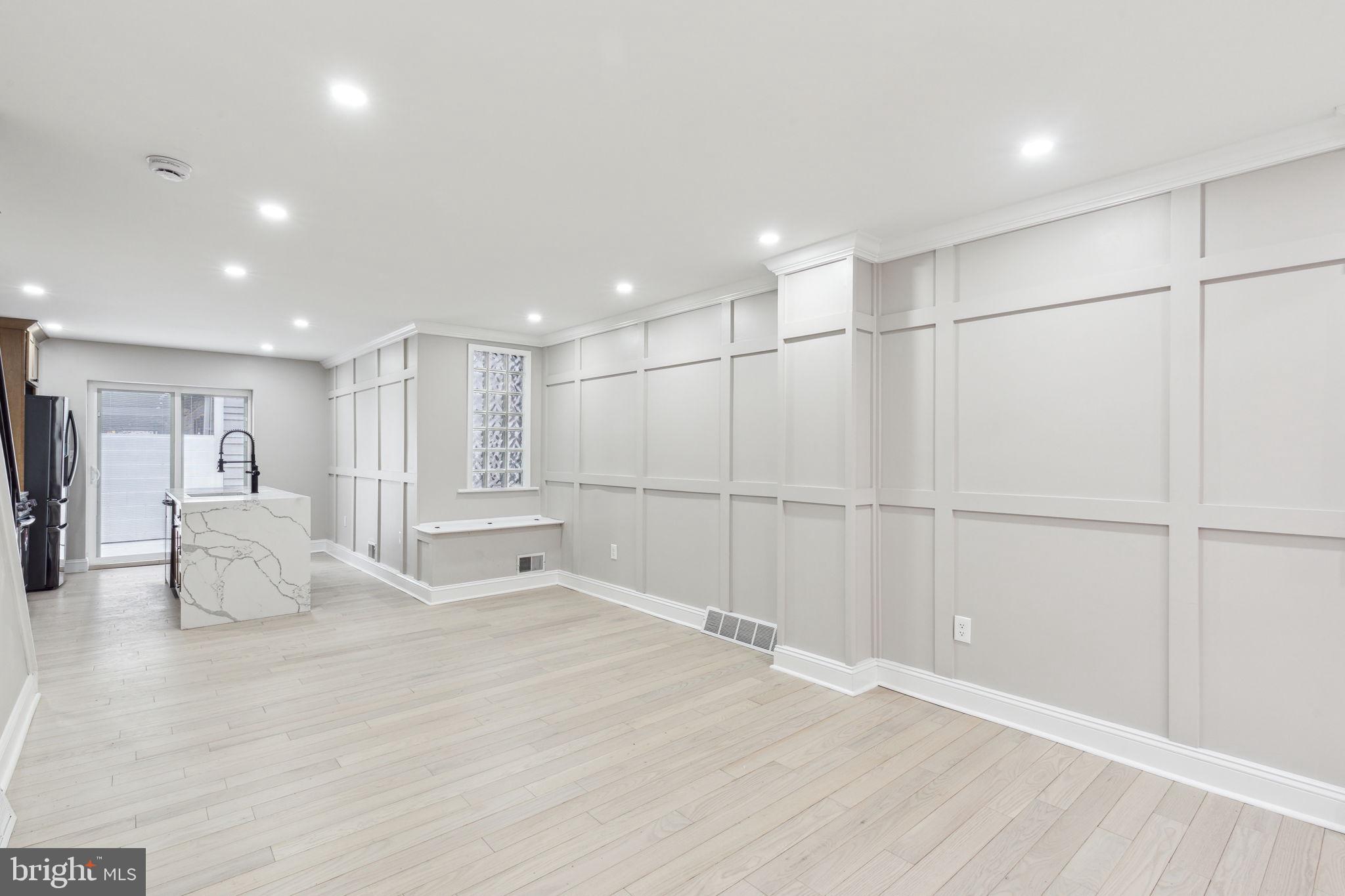 Welcome to 925 S 18th Street – a classic and stately brick rowhome in the heart of Graduate Hospital that’s been fully updated with contemporary and luxurious finishes throughout! This spacious 3-story home features high ceilings and great natural light. The main level provides a warm and inviting space for everyday living and entertaining, with beautiful wainscoting and a spacious kitchen with an island and gorgeous finishes. Off of the kitchen is access to a large backyard, perfect for outdoor grilling and entertaining. The full unfinished basement offers ample storage space and the potential for a home gym. The upper levels offer generous space in the 4 bedrooms and plenty of flexibility for a home office or guest room. The primary bathroom is absolutely stunning with high end finishes. Whether you're looking to settle into a vibrant neighborhood or invest in a well-located home with tons of potential, this one checks all the boxes. Just steps from local favorites, parks, and an easy stroll to Center City—925 S 18th Street is ready to welcome you! All square footage numbers are approximate and should be verified by the buyer. It is the responsibility of the buyer to verify real estate taxes.