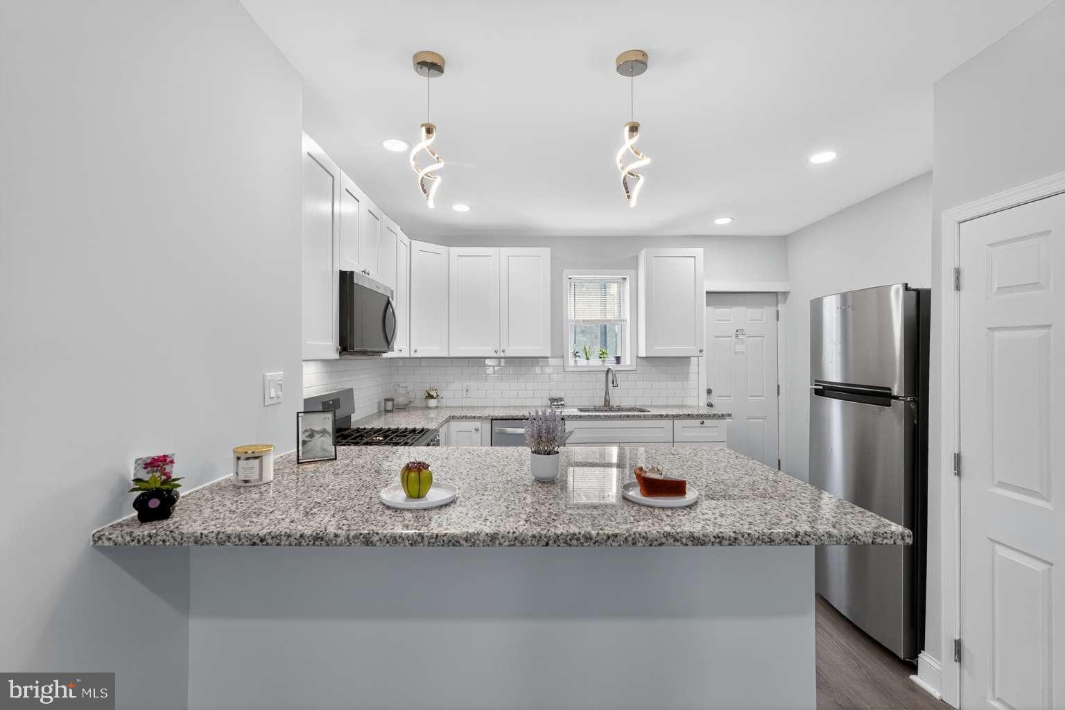 Check out this very affordably priced, remodeled home in the Frankford neighborhood, perfect for the 1st Time Home Buyer or Investor. This gem offers recessed lighting, open floor plan, beautifully remodeled kitchen with granite counter tops, New four piece stainless steel appliance set (refrigerator, range, dishwasher, and over the counter microwave) , New luxury vinyl plank flooring on first floor, New wall to wall carpeting and stunningly remodeled modern bathroom on second floor. New windows and doors, Roof was silver coated July 2025 and comes with warranty. New 200 Amp Electric Panel was installed. This home offers plenty of outdoor space with a nice front patio and a quiet private back yard perfect for barbequing and relaxing. This house is one of the most affordable, remodeled, conveniently located homes in the city. Shopping, schools, playground, restaurants, night life, major highways, public transportation are all close by. Center City, Fishtown, I-95 and the bridges to get to New Jersey are all just a few minutes away, and New York City is a little over an hour! This home has what most home buyers and investors are looking for: Affordable, Beautifully Remodeled, Stable Historic Neighborhood, Excellent Location, Surrounding Home Values are Increasing!!!