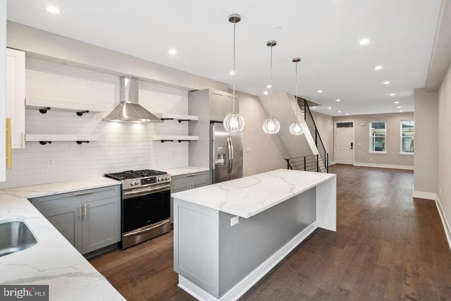 Stunning new home in Point Breeze brought you by custom home builder Lily Development. These homes have it all. Fireplace, 10 year tax abatement, roof deck, and amazing finishes throughout. Enter into your home welcomed by warm hardwood floors throughout. Plenty of space for entertaining in your gorgeous living room with ample room for a formal dining room off the kitchen and fireplace with floor to ceiling tile surround. Amazing kitchen with two toned kitchen cabinetry, over-sized quartz counter with waterfall edge and capable of seating 5 people. Luxurious appliance package, slide in range with professional vent hood, designer light pendants and tiled back splash up to the ceiling!! Wander upstairs where two ample bedrooms await. With great light throughout, these spacious bedrooms offer respite from the daily world. Full sized washer and dryer located next to the full sized bathroom. Only a little farther up, and you've entered the beautiful master suite. With voluminous light throughout, you'll enjoy a walk-in closet. The master bathroom is completely outfitted with his and her sinks, stand alone soaking tub, and glass door shower, you'll feel like it's a day at the spa. Just outside of the master there is a wet-bar with sink, cabinetry and wine cooler! Do not forget about your rooftop deck! A great space for entertaining and enjoying the city views! Home built by the custom home builder Lily Development. many upgrades come standard in this beauty. Over sized layout, wide open spaces, large rooms with tons of closets. You will not disappointed!All square footage numbers are approximate and include above and below grade square footage. Square footage should be verified by the buyer. It is the responsibility of the buyer to verify real estate taxes.