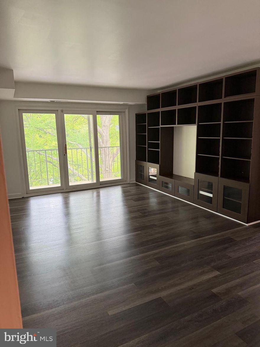 Light-filled 2BR/1BA condo with open living/dining space, private balcony overlooking trees, and generous storage throughout. Features updated flooring, built-in shelving, and a functional kitchen with pass-through to dining area. Well-sized bedrooms including a walk-in closet with custom organization. Conveniently located near metro, bus stops, shopping, dining, and major commuter routes. Walter Johnson School Cluster. Community pool and condo fee includes most utilities and maintenance. Great opportunity for homeowners or investors.
