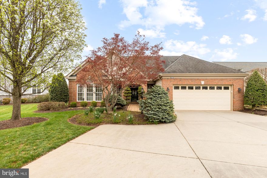 Welcome home! Experience 55+ living at its finest in the beautiful gated community of Heritage Hunt! Home backs to Golf Course!  Gleaming hardwood floors greet you at the entrance and lead you into the open living room, where you’ll discover a high vaulted ceiling, cozy glass fireplace, and wall-to-wall windows bathing the home with natural light. With an expansive and open floor plan, the living room opens directly into the gourmet kitchen, boasting bright modern cabinets, sleek granite countertops, a double wall oven, and an oversized island bar. All new SS Appliances! Enjoy casual meals in the sunny breakfast nook, or host family and friends in your formal dining room just off of the foyer. With large windows and beautiful built-in shelving, the 2nd main level BR also makes an ideal corner office and is the perfect peaceful place to take conference calls and work from the comfort of your home. No need to worry about stairs on a daily basis, with this magnificent main level primary bedroom! You’ll love the dramatic vaulted ceilings, plush carpeted flooring, and amazing walk-in closet with custom closet system. The elegant en suite bathroom is generously-sized, featuring two separate vanities and a spa-like shower experience with a built-in seat and luxurious wall jets. Upstairs you’ll find the perfect private space for visitors, with a bonus loft, second bedroom, and third full bathroom. The third bedroom includes two wide closets and floor-to-ceiling built-in cabinets, an ideal space for a craft room or art studio. From the kitchen, enter your spacious screened-in porch to sip your morning coffee or curl up with a good book in peace, surrounded by lush grass and beautiful landscaping in your backyard. On the front of the home, the two-car garage and widened driveway offer you plenty of additional space for both parking and storage. Take advantage of the abundant exclusive amenities, including indoor and outdoor pools, two clubhouses, on-site fitness center, tennis courts, and an 18-hole championship golf course! The HOA fee also includes high-speed internet and cable TV. Just two miles to Harris Teeter, Starbucks, and Dunkin! Minutes to everything you need - Wegmans, Target, Walmart, The Shops at Stonewall, Virginia Gateway, Regal Cinemas, UVA Health, Manassas Battlefield Park, Bull Run Regional Park, Hylton Performing Arts Center, Jiffy Lube Live and more! Quick access to the area’s major roads including Route 66, Route 29, Route 15, and Sudley Road. Schedule a private tour of your stunning new home today and start enjoying retired life in style!