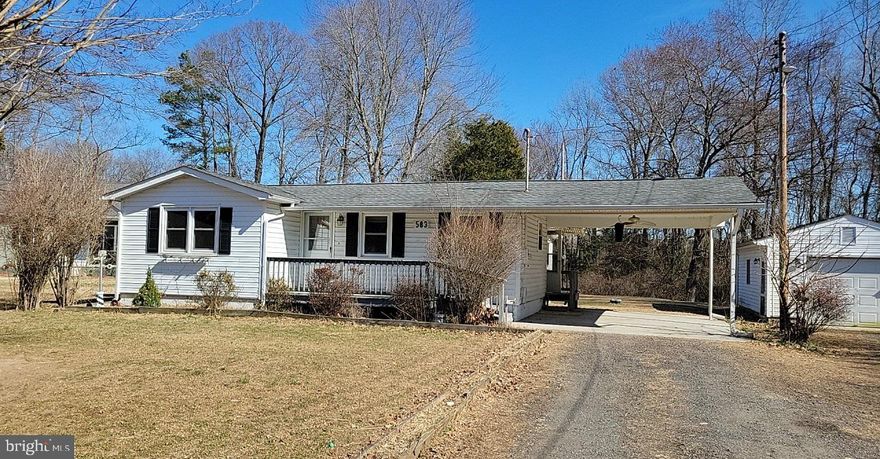 Ranch with vinyl siding, 2 Bedrooms, 1 Bath in water oriented Placid Bay Estates, situated on two lots, attached carport and a detached one car garage,  heat pump with propane back up; vinyl windows, vinyl plank flooring, tank-less water heater.  Placid Bay Estates is a golf cart-friendly community and has a voluntary HOA for amenities, boat ramp, community center, and freshwater lakes. Conveniently located for an easy commute to Colonial Beach, Dahlgren, and Fredericksburg.