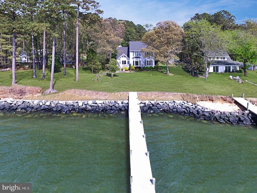 Breathtakingly Beautiful Waterfront Home in sought after Tall Timbers. This one of a kind, custom home on the Potomac River has an Open Concept Floorplan with Hardwood Floors and Custom Blinds throughout.  Marvelous Views from every Anderson Window. The 2,486 sq/ft Main House has 4 Bedrooms, 2 Full Bathrooms and a Communal Loft.  Large Bright Kitchen with Stainless Appliances, Corian Countertops, Under-cabinet Lighting and an Island with Plenty of Seating and Storage.  Cozy Living Room with Gas Fireplace overlooks an Attractive Dining Room with Custom Triangular Windows and Cathedral Ceilings.  Lovely Master Bedroom on the Main Level overlooks the River and has an Ensuite Master Bathroom with a Large Shower, Jetted Tub and Walk-In Closet.  Long, Stamped Concrete Driveway leads to an Oversized Detached 2 Car Garage that has a Finished Studio above with an additional 600 sq/ft of finished space for f a future Office, Den, Gym or Game Room.  The owner s goal was to create a socially inviting space that was also low maintenance....and they achieved it.  This Wonderful Home was built in 2002 by Riverside Builders on a one (1) acre lot with Western Exposure. Enjoy incredible Sunset Views from the Charming Composite Deck and experience the Sunrise from the Inviting Covered Front Porch. 90 foot Private Pier with Electricity, Rip-Rap along the Shoreline and a Grassy Lawn in both the front and back yards of the home.  This extraordinary property demonstrates pride in ownership and has been treasured by the original owner.