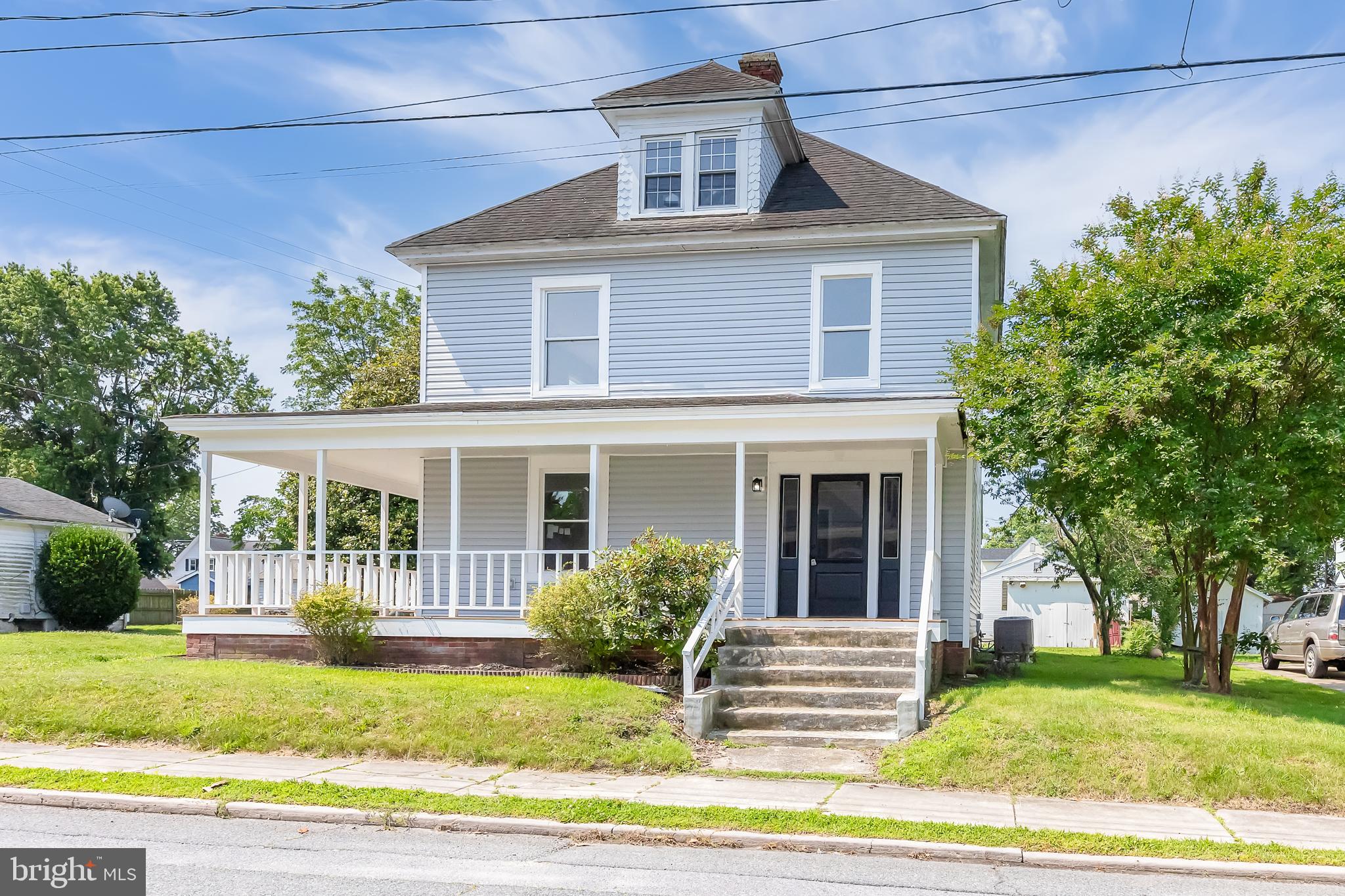 A beautifully fully renovated corner lot Farmhouse is ready for its new owners! Offering 3 bedrooms and 3 full bathrooms, with just under 2,000 sqft, this home combines old charm with modern finishes. Upon arrival you are greeted with a wrap-around front porch which welcomes you into the spacious foyer. High ceilings and seamless LVP flooring flow throughout the first floor to really allow all that natural sunlight to fill the home. The first floor offers an open concept feel while still having some separation. The foyer leads into the living room which circles around to the large kitchen and dining room. The renovated kitchen has all new soft-close cabinets, quartz countertops, a large island, and a deep sink overlooking the backyard. Off of the kitchen you will find a spacious utility room with washer and dryer, and offers plenty of space for extra storage and also includes a separate entrance from the driveway. Headed upstairs you will find 3 bedrooms and a hallway full bathroom. The primary bedroom spans one side of the 2nd floor and is complete with an en-suite bathroom with double vanity, a walk-in closet and an extra closet. There is off-street parking available with the gravel driveway with new stone. There is a storage shed to house your outdoor equipment. You have quick access to 13 towards Chincoteague and Wallops, or towards Salisbury or Ocean City. Enjoy the low maintenance with all new windows, new siding, new HVAC, etc and come make this house your home!