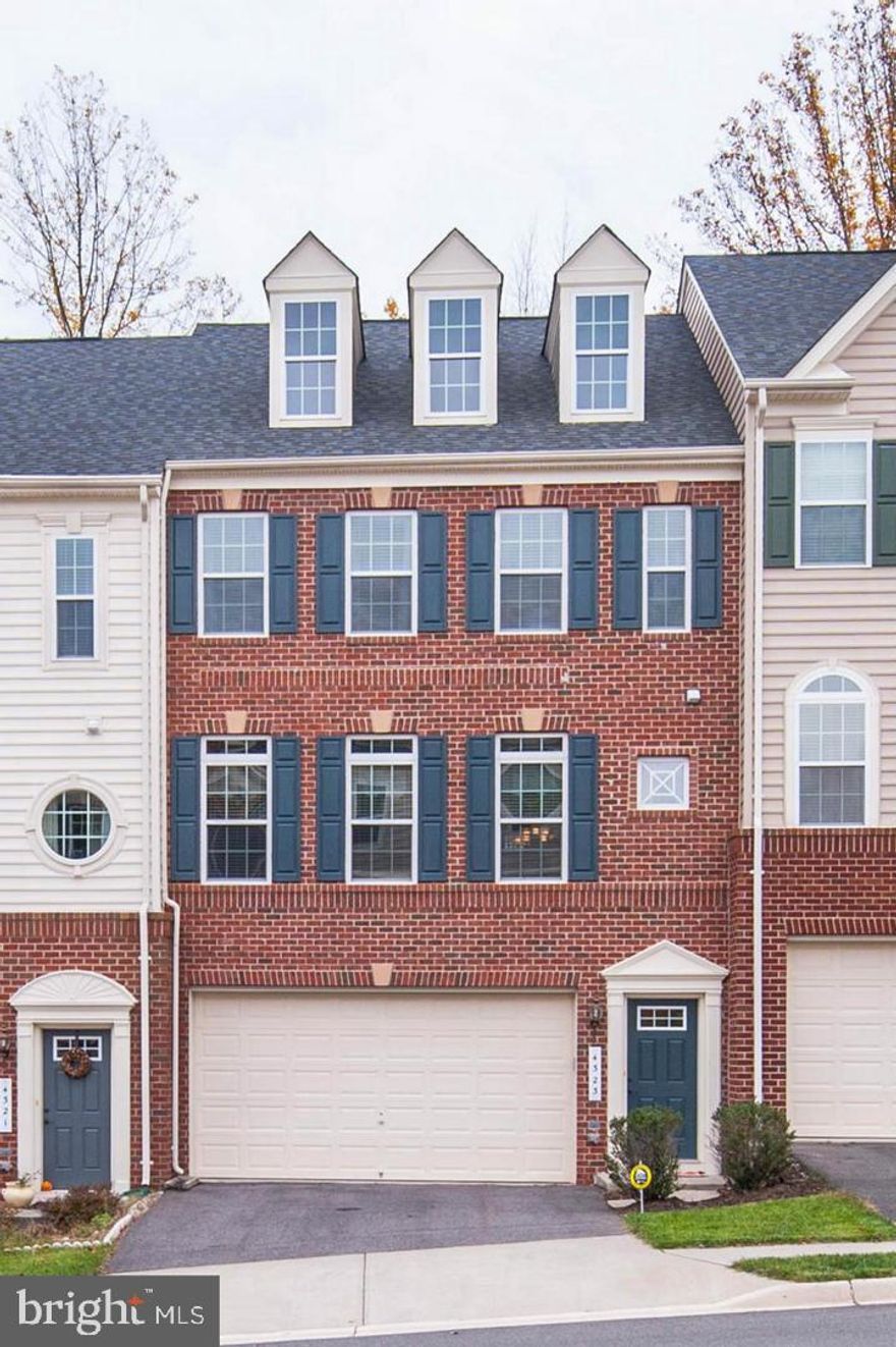 Opportunity Knocks! Don't miss your chance to live in this IMMACULATE & PRISTINE Large brick townhouse. This home has all the bells & whistles! Over 2500 Sqft with an open floor plan! Special features include: stainless steel appliances, granite counters, gas cooking, hardwood floors, upgraded wood cabinetry, composite deck, gorgeous wooded views, a bathroom on every level of the house, two car garage & more!