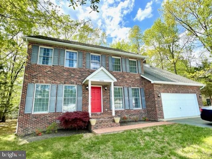Enter this beautiful home from the brick walkway, covered portico, & into the 2-story foyer with almost 3,000 square feet of living space.  The open and spacious kitchen is truly the heart of the home, with plenty of cabinets, counterspace, center island, table space, hardwood floors, and view of your open family room with whitewashed brick fireplace, hardwood floors, and drenched in natural lighting from all the windows on the back side of the house.  Entertain on your deck, with built-in seating and half acre, level yard.  There is also a living room, dining room, and office space, that could also be used as a playroom/home schooling or even as the 5th bedroom, on the main level.  The half bath on main level could potentially become a full bathroom. Retreat upstairs to your large primary bedroom, with vaulted ceilings, skylights, whitewashed brick fireplace and balcony, to enjoy your morning coffee & listen to the sounds of nature. This primary bedroom has 2 primary bathrooms, with vaulted ceilings, skylights and all the space you need to unwind and get ready for each day.  2 walk-in closets provide plenty of room for your belongings.  There are 3 other spacious bedrooms and another full bathroom with double sinks, vaulted ceiling and skylight, located on the second level, as well.  Storage is not an issue in this home with many closets, 2 car garage, and a shed. A 1 year home warranty has already been put in place for the buyers. This home is in the desirable community of King's Grant and has a walking path to Tilghman Lake across from the main neighborhood entrance. The school bus stop is directly across from your new home. Close to schools, parks, shopping, restaurants, hospital, and commuter lots.  Within 30 miles +/- to PAX Naval Air Station, Naval Surface Warfare Center in Indian Head, Naval Support Facility Dahlgren, VA, Andrews Airforce Base, D.C, and Alexandria, VA. Don't miss out on this beauty!