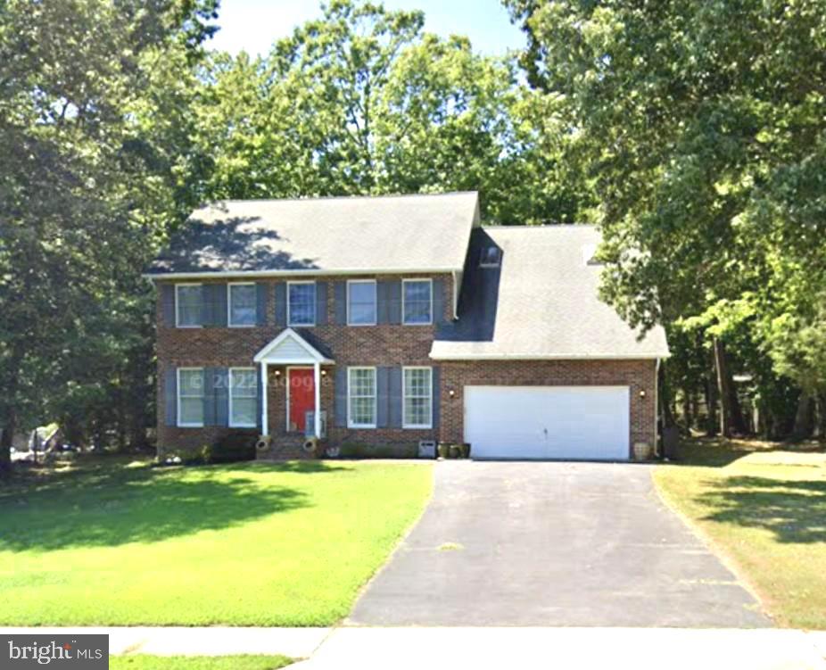 Enter this beautiful home from the brick walkway, covered portico, & into the 2-story foyer with almost 3,000 square feet of living space. The open and spacious kitchen is truly the heart of the home, with plenty of cabinets, counterspace, center island, table space, hardwood floors, and view of your open family room with whitewashed brick fireplace, hardwood floors, and drenched in natural lighting from all the windows on the back side of the house. Entertain on your deck, with built-in seating and half acre, level yard. There is also a living room, dining room, and office space, that could also be used as a playroom/home schooling or even as the 5th bedroom, on the main level. The half bath on main level could potentially become a full bathroom. Retreat upstairs to your large primary bedroom, with vaulted ceilings, skylights, whitewashed brick fireplace and balcony, to enjoy your morning coffee & listen to the sounds of nature. This primary bedroom has 2 primary bathrooms, with vaulted ceilings, skylights and all the space you need to unwind and get ready for each day. 2 walk-in closets provide plenty of room for your belongings. There are 3 other spacious bedrooms and another full bathroom with double sinks, vaulted ceiling and skylight, located on the second level, as well. Storage is not an issue in this home with many closets, 2 car garage, and a shed. A 1 year home warranty has already been put in place for the buyers. This home is in the desirable community of King's Grant and has a walking path to Tilghman Lake across from the main neighborhood entrance. The school bus stop is directly across from your new home. Close to schools, parks, shopping, restaurants, hospital, and commuter lots. Within 30 miles +/- to PAX Naval Air Station, Naval Surface Warfare Center in Indian Head, Naval Support Facility Dahlgren, VA, Andrews Airforce Base, D.C, and Alexandria, VA. Don't miss out on this beauty!