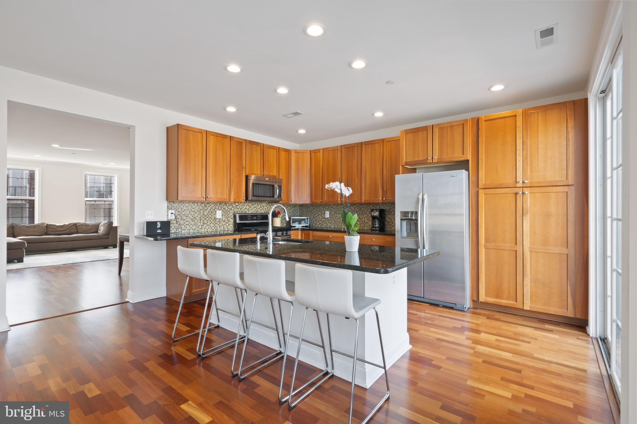 Extraordinary Naval Square opportunity: 23' wide, pristine 3 bed, 2.5 bath townhome with deeded parking. This exquisite 2-story home features a modern custom kitchen and newly renovated owner’s bath. Enjoy spectacular sunsets & city views from the southwest facing terrace! On the first level, you will be welcomed into a spacious open concept living/dining area with Brazilian cherry hardwood flooring, luxe lighting by Mitchel Gold and a hardwired speaker system by Bose. Next, flow seamlessly into the well designed kitchen with natural cherry cabinets, Whirlpool Gold appliance suite, newer Bosch dishwasher, glass tiled backsplash & granite counters. A generous counter height island is ideal for entertaining guests and a large pantry will meet all of your storage needs. Adjoining family room opens to a serene terrace, perfect for relaxation. On the second level, you will find an elegant owner's suite with vaulted ceilings and an oversized walk-in-closet, completely outfitted with custom built-ins. The highlight of this space is the recently renovated owner’s bath featuring a large frameless glass shower with Carrara marble tile from floor to ceiling. Dual vanity features sleek white quartz tops and all chrome fixtures are Kallista by Kohler. Beautiful herringbone tiles and custom shelving complete this luxurious space. On this level, you will also find, two additional sunlit bedrooms, full bath, and laundry closet with newer LG washer & dryer. Enjoy neutral paint, Hunter Douglas window shades (blackout in back bedrooms) and recessed lighting throughout. Elfa Shelf custom closets grace the entire home. Ample storage space located in the large closet within the vestibule (unique to this home). Deeded pull-in parking space, is just steps from the home. All this with fantastic Naval Square amenities: concierge, state-of-the-art fitness center, seasonal pool, dramatic community room w/40' domed ceiling (also available for private functions), 24-hour secure, gated community. Enjoy the outdoor amenities of the 20-acre park-like setting: including picnic areas, well-kept gardens and mature Sycamore trees. Directly out the back gate you can walk to the Schuylkill River Park, including the Award Winning Trail & Boardwalk, Markward playground and dog park! Exciting restaurants, shops and cafes, including the brand new Heirloom Market by Giant are all just steps outside the gates. 410 Regatta Drive is a truly unique home within the most beautifully landscaped community in all of Center City Philadelphia. Incredible central location, within easy walking distance to UPenn, CHOP, HUP and Drexel as well as both Fitler and Rittenhouse Square and the vibrant Graduate Hospital neighborhood. New hot water heater recently installed. Tax abatement until 3/28/2022.