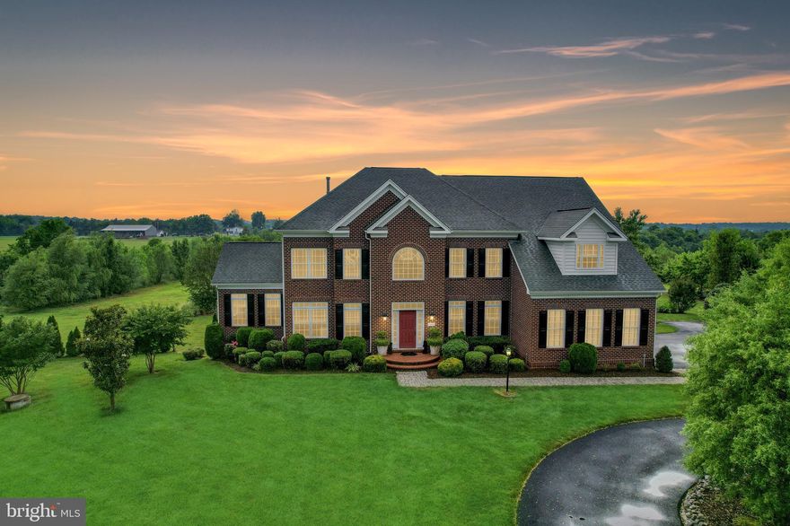 Resplendent! This magnificent home has a grand 2-story entrance with a stately, wide entry staircase which splits left and right at a mid-point landing, creating a two story balcony foyer which will take your breath away.  Prepare to be dazzled by the many interior and exterior features starting with the gleaming cherry wood floors which reflect abundant natural sunlight flooding into this home and sprawl throughout the main level. The stately two-story family room has a cozy gas fireplace and a wall of windows ushering in more natural light. The kitchen is a culinary oasis with a large granite island, a prep sink, a large pantry, and plenty of cabinets and granite covered counter space! For large social gatherings, the super-sized eating area off the kitchen can handle plenty of guests. Enjoy the retreat of the quiet sunroom with a soaring vaulted ceiling and ceiling fan. Work from the convenience of home in the main level office which also has a storage closet. Lavish in the enormous owner's suite featuring a large bedroom space, a spacious sitting area, and a large walk-in closet, and the master bathroom includes a jetted tub and a walk-in shower. The finished basement provides plenty of recreation space, gym, office, storage and a full bathroom. Enhance your fitness experience with the fully functional 6-person Health Mate Far Infrared cedar lined sauna! Enjoy energy savings with the high-end underground renewable geothermal heating and cooling system manufactured by ClimateMate. Need even more space? Take the stairs to the 2nd upper level and finish out a large bedroom and hobby or rec area, roughed in for a full bathroom and HVAC! Moving outside, there is a large fruit garden hosting blueberry plants, peach, plum, Asian pear, cherry, fig, and persimmon trees, plus an area for vegetable gardening. You'll also find  an extra shed for lawn equipment and an enormous detached garage with a large two-car bay, a separate workshop area, and an RV bay where you can keep up to a 38-foot motorhome. There is also ample storage above the two car bay and separate workshop! Brentsville HS district...rural living doesn't get any better than this exquisite and desirable combination of practicality, gardening, and estate living!