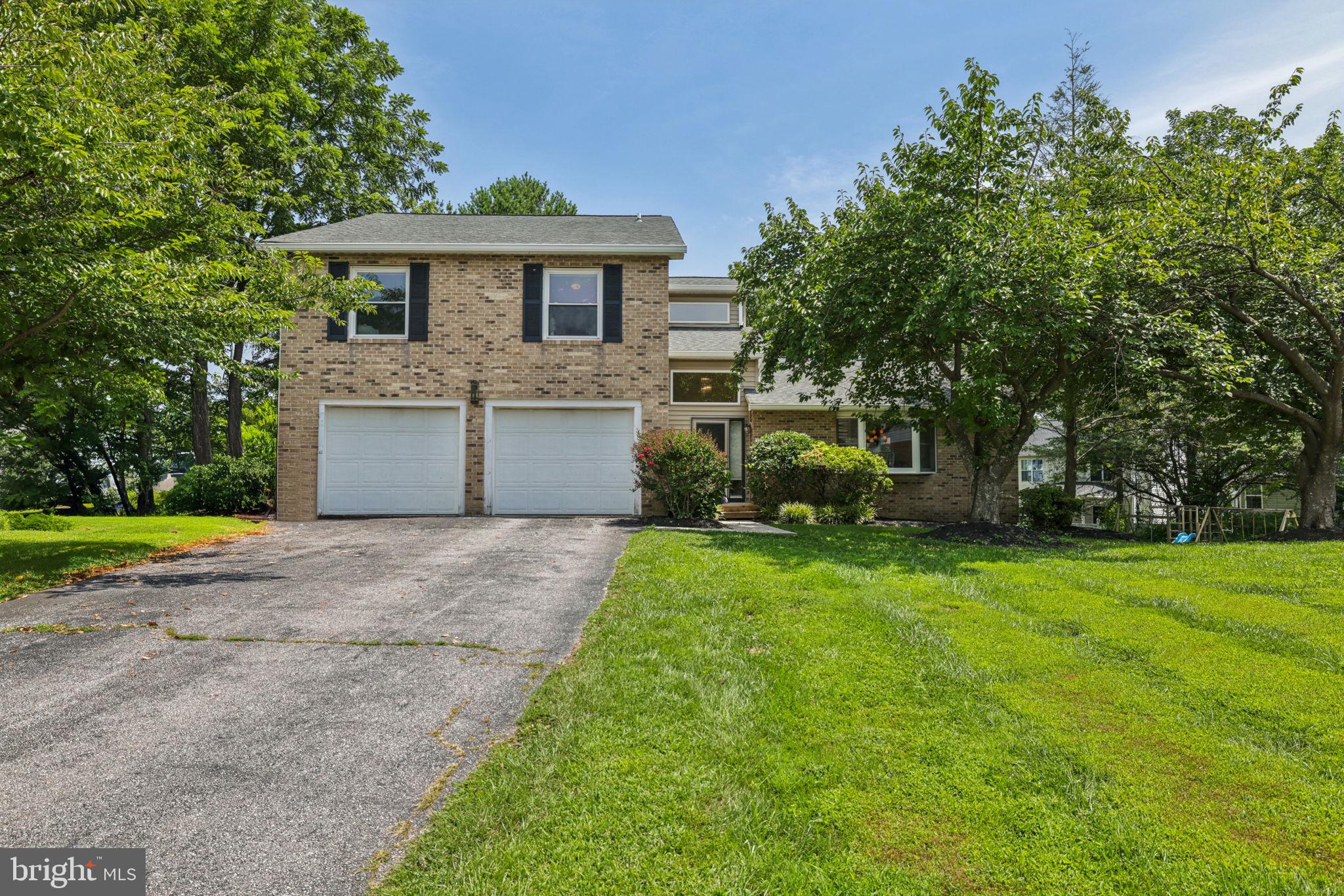 Come see this great 4 bedroom, 3.5 bathroom home on a cul-de-sac located in sought after Berrymans Hollow located right in Reisterstown. With 2,753 square feet of living space, there is plenty of room with features that include: large living room with hardwood floors and huge bay window, formal dining room with crown molding and hardwood floors as well, kitchen with stainless appliances, kitchen island, garden window, pantry and a slider out to the large deck where you can admire the fully FLAT backyard that backs to the very spacious common area for all to enjoy. Back inside, the sunken family room is next, it also has a slider out to the deck and backyard. The family room is complete with a wood-burning fireplace flanked with two custom built-in bookshelves, hardwood flooring, and recessed lighting. Off of the family room is the powder room and door out to the 2-car garage. The upper floor is where you will find the 4 bedrooms and 2 full bathrooms. The primary bedroom is generously sized and has a ceiling fan, 2 closets and an en-suite bathroom with vaulted ceilings, large soaking tub, separate shower, and double vanity. All of the other 3 bedrooms have ceiling fans too. The guest bath has been updated and has a double vanity with a marble top and a custom tiled floor. The lower level is finished and has a 2nd family room with room for a home gym, home office, playroom, you name it! It's at walkout level and has plenty of storage. All of this and the location can not be beat, you'll be close to shopping, restaurants and easy to jump right onto 795, 140, 30 and 695! Check out the virtual tour!
