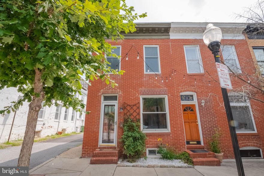 This end-of -group home in Butchers Hill is a blend of historic architecture and contemporary living. Home has been updated to show architectural details and maximize its function. Step inside to discover spacious and well-designed living areas. Downstairs are wonderful oak/mahogany in-laid floors, with Georgia pine upstairs. Updates to the kitchen, bathrooms, and loads of details make this home move in ready. High ceilings and the many windows create an open and airy atmosphere, allowing natural light to brighten the space throughout the day. This home features two nice size bedrooms. Thoughtful design ensures that each bedroom is functional and cozy. The private backyard retreat offers a patio-garden, under the shady magnolia’s, to sit, relax and unwind. Step outside to visit local, award winning restaurants and cafes or the local brewery just around the block. Immerse yourself in the best that City life has to offer. Grocery stores, pharmacies, and other essential amenities are all in close proximity. House is only a block away from Patterson Park, where you will find tons of festivals, sporting and cultural events. Convenient access to major roadways and public transportation. Johns Hopkins Blue Jay Shuttle bus stop is just up the street. With its prime location, historic charm, and easy access to neighborhood businesses and amenities, this property offers an exceptional lifestyle.