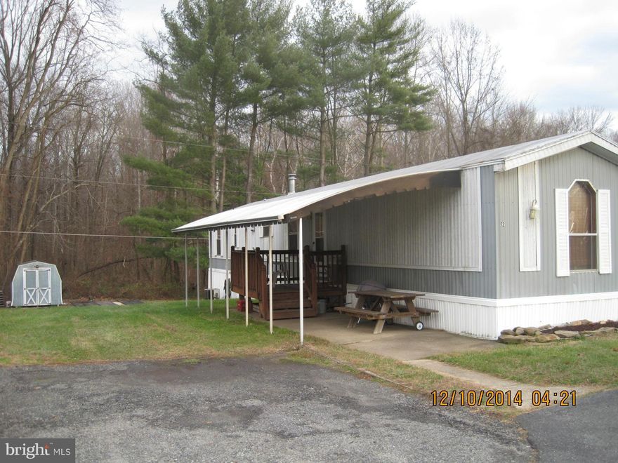Own this three bedroom 2 bath mobile which backs to the woods! 1997 single wide includes a shed - newly sealed roof, comes with fridge, stove and new dishwasher! New laminate floor in kitchen and a washer and dryer hook up! Lot rent is only 380 per month and includes water, sewer and trash pick up! You can be in by 2015! Additional storage under the unit! minutes to 95,40, Marc train, and APG.