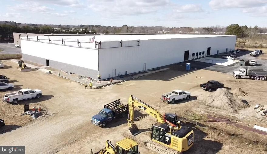 This newly constructed 60,000 square foot warehouse/flex building is located within the Denton Industrial Park, offering a strategic location for both investors and owner-users. The property is now partially leased, with a fresh five-year lease in place for 30,000 SF, providing immediate, stabilized income. The remaining 30,000 SF is available for lease and can be subdivided into smaller suites to accommodate multiple users or a single tenant.

The property is the newest addition to the Denton Industrial Park, positioned centrally on the Delmarva Peninsula. It benefits from excellent regional connectivity, located directly along US Route 404, a major east–west transportation corridor serving Delmarva.
The site offers close proximity to all major transportation routes, including US Route 301, US Route 50, & US Route 13 through Delaware. The location allows for efficient access to key regional markets, including the Western Shore of Maryland via the Bay Bridge (approximately 20 minutes), Lower Shore markets - including Sussex County, Delaware and the Salisbury, Maryland area.

Acquire a newly constructed industrial asset with immediate cash flow, leasing upside, and long-term flexibility. With strong access to regional transportation infrastructure and growing demand for modern industrial space on the Delmarva Peninsula, the property is well positioned for continued leasing momentum and value appreciation.