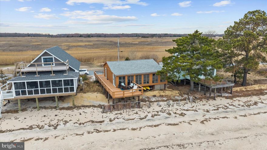 Bayfront living awaits at 201 S. Sandpiper Dr. in the quiet, one‑road‑in community of Pickering Beach. This rare offering includes two lots, with the front lot directly on the Delaware Bay and the rear lot bordering a protected nature preserve for exceptional privacy and unobstructed natural views.

Enjoy sunrises over the bay and sunsets across the marsh from the home and deck, creating a stunning backdrop of water, sky, and wildlife. Outdoor recreation is right at your doorstep—walk the beach, explore the nature preserve, or launch into kayaking, crabbing, and fishing just steps from the property. The neighborhood offers a peaceful, private setting with public beach access nearby.

A unique opportunity to own bayfront property surrounded by preserved land and coastal beauty, ideal for a year‑round residence or tranquil retreat.