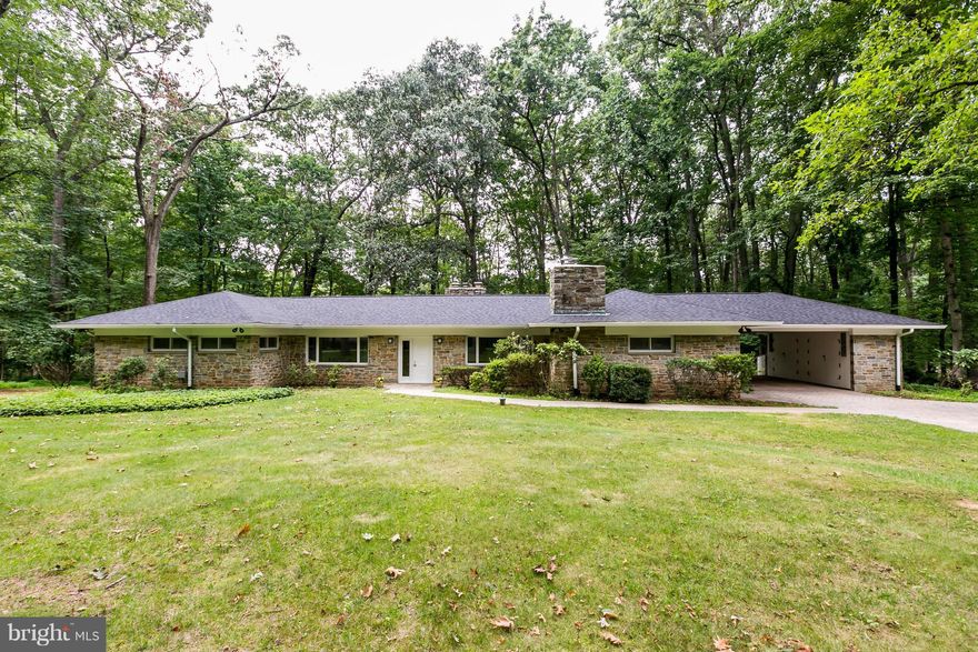 ACCEPTING BACK UP OFFERS! Light filled Mid Century Modern stone rancher on level lot on cul de sac.  Includes Don Draper's Dream Bar in large 20' x 40' Family Room!  Open plan design, great for entertaining. Indoor & outdoor w.b. FPs.  Radiant heat in floors. Great views of 1.6 acre wooded lot from all directions.  Rear paved patio and large deck.  2-car carport with storage.  Many MCM features!