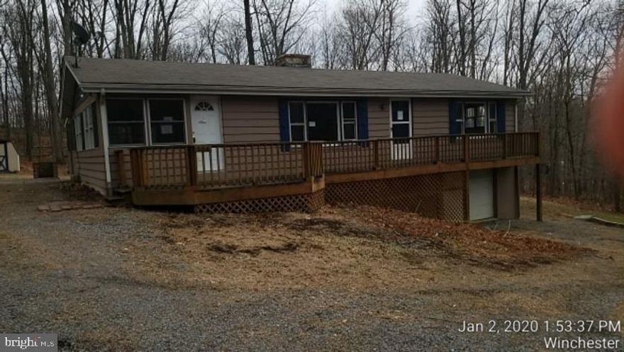 Looking for new owner. Cozy two bedroom, one bath rancher. Nice stone wood burning fireplace, nice flat backyard, basket ball court. No HOA but there is a Sanitary District fee applies. Conveniently located towards the front of Shawneeland subdivision. Easy commute to Winchester.  Property is being sold "as-is".  Still needs some TLC but lots of potential.  Call today and schedule a showing